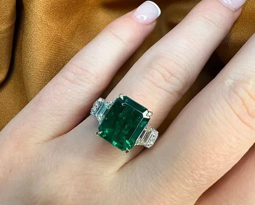 Emerald Cut 5.57 Carat Emerald Three Stone Ring For Sale