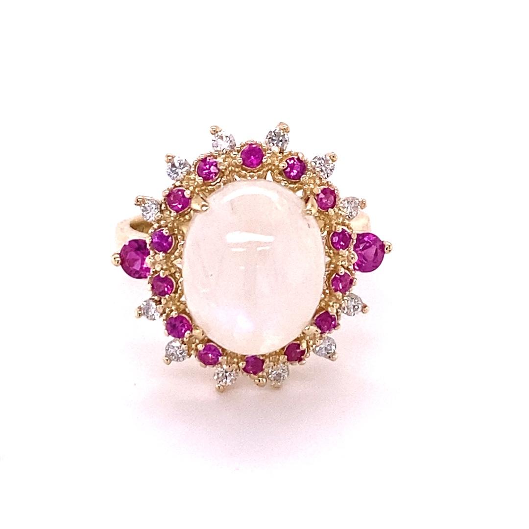 5.58 Carat Natural Moonstone Pink Sapphire Diamond Yellow Gold Cocktail Ring

Item Specs:

Oval Cut Moonstone that weighs 4.83 Carats
16 Round Cut Pink Sapphires that weighs 0.53 Carats
12 Round Cut Diamonds that weigh 0.22 Carats (Clarity: SI1,