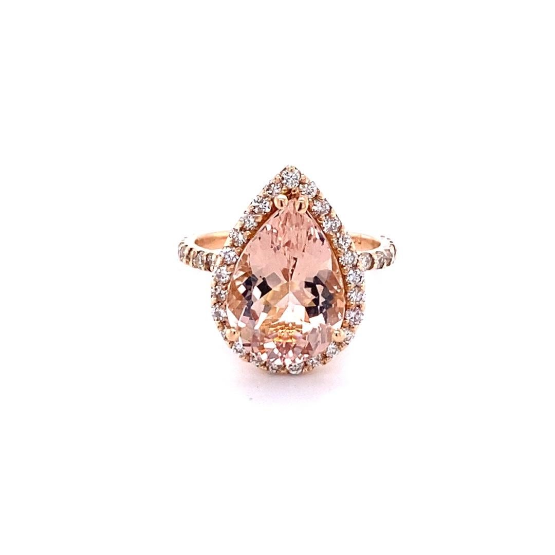 5.58 Carat Pear Cut Morganite Halo Diamond Rose Gold Engagement Ring

A gorgeous ring that can easily be transformed into an engagement ring for that special someone!  It has a stunning 4.73 carat Pear Cut Morganite set in the center of the ring and