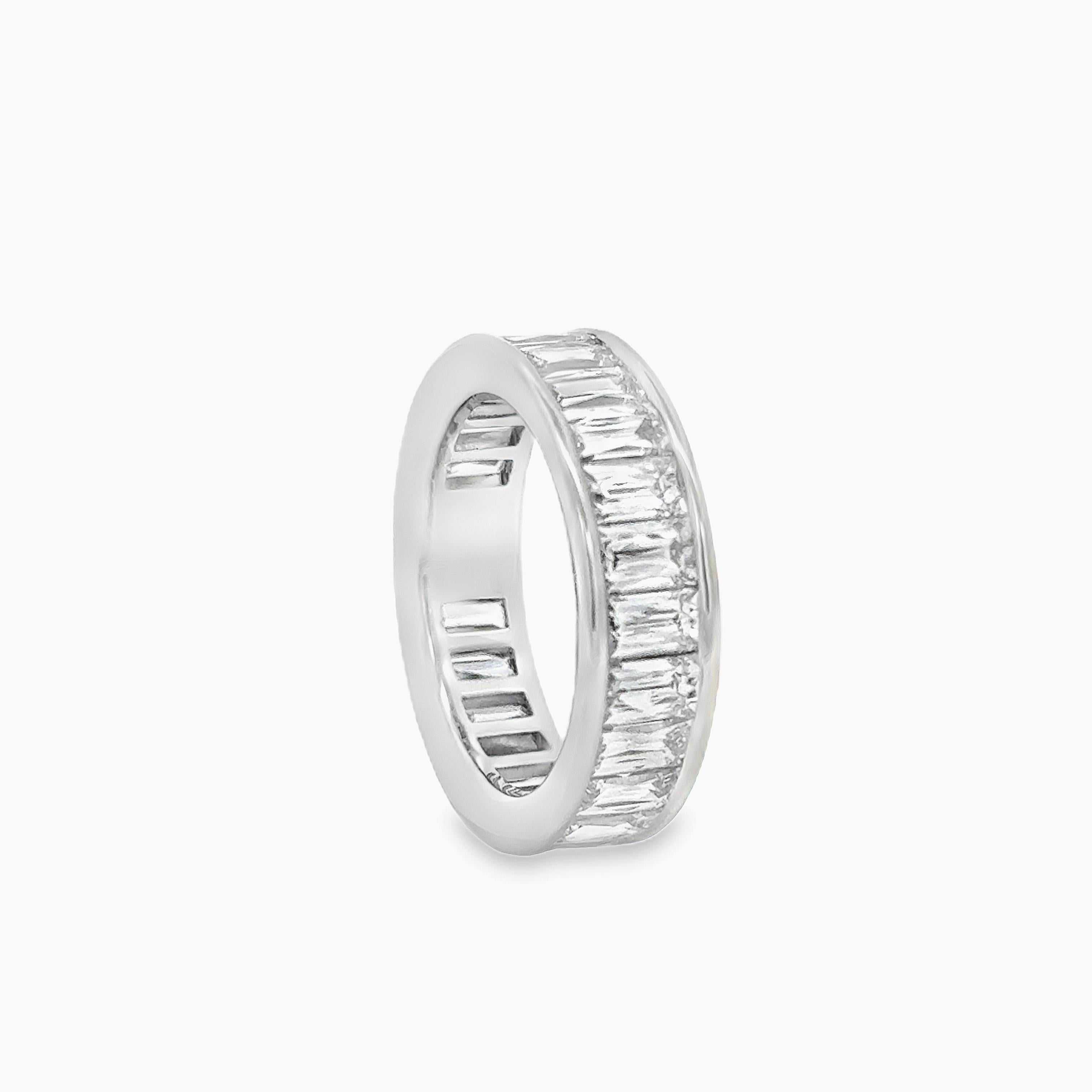 A gorgeous eternity wedding band, showcasing 24 elongated French cut diamonds weighing 5.58 carats total, channel-set beautifully on a platinum mounting. Size 6.5 US. 

Roman Malakov is a custom house, specializing in creating anything you can
