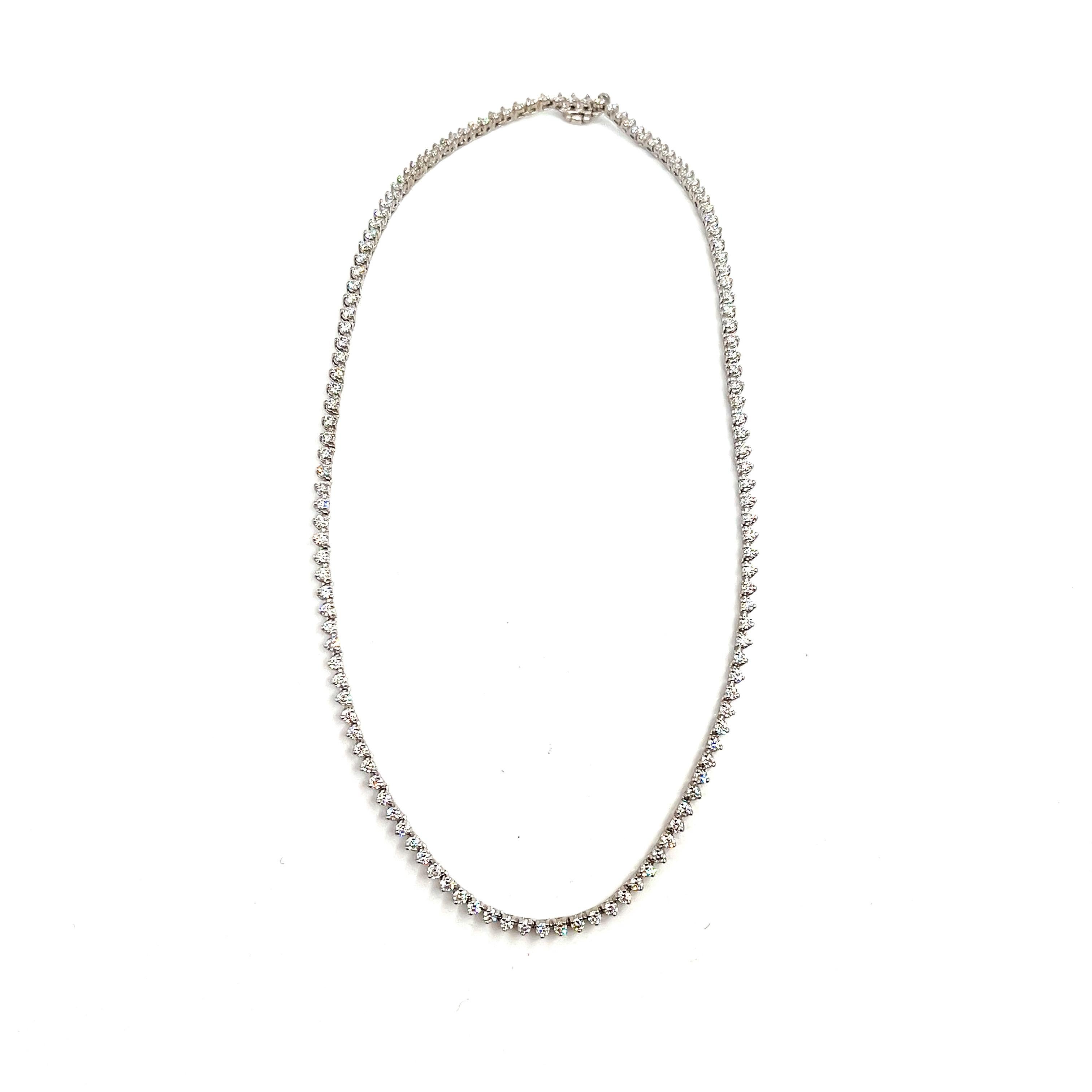 This gorgeous 5.58 ct diamond tennis necklace has 136 diamonds set in 14k white gold. The diamonds brag F/G in color and VS2/SI1 in clarity. A stunning necklace for yourself or as a gift. 