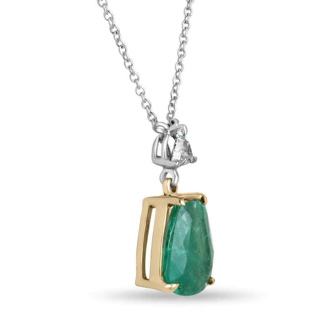 A magnificent and one-of-a-kind piece, this is a natural emerald and diamond necklace that is sure to turn heads. It features a large irregular cut emerald that carries more than five carats, and showcases a remarkable lush dark green color with a