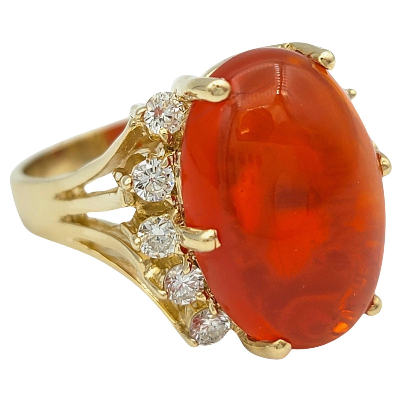 Ring Size: 5.75 

Introducing this breathtaking 5.59 carat red fire opal ring, a true masterpiece of color and brilliance. This captivating oval cut gemstone, with its fiery red hues and smooth cabochon cut, exudes a warmth and intensity that is