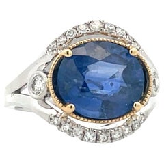 5.59 ct. Oval Sapphire with Diamond Halo Engagement Ring in Platinum