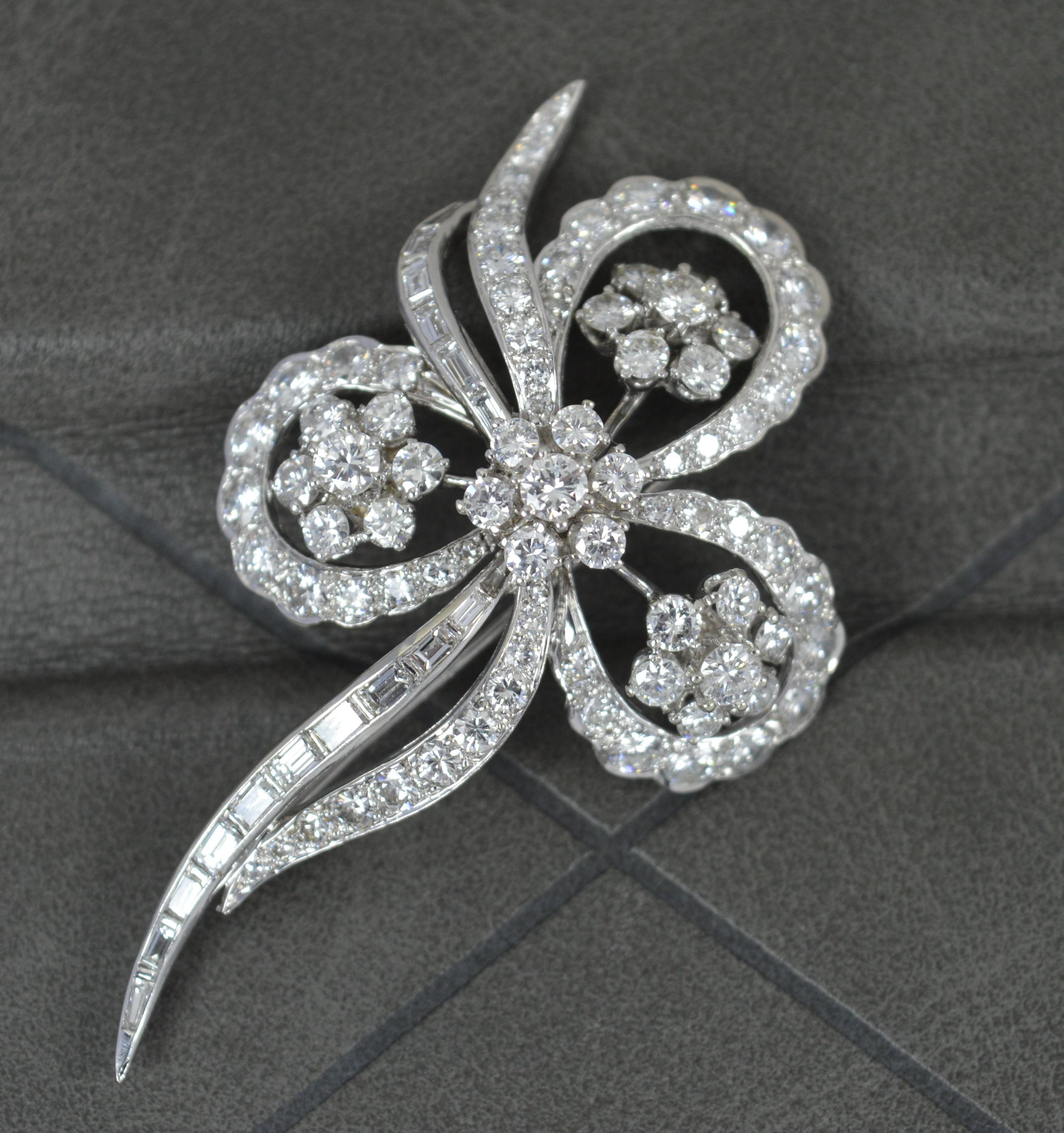 A fantastic floral brooch.
Solid 18 carat white gold example.
Set with many round brilliant cut diamonds to total approx 5.50 carats. Vs clarity, e-f colour. Exceedingly good, sparkly example.
Trefoil floral flower head. Set with round brilliant and