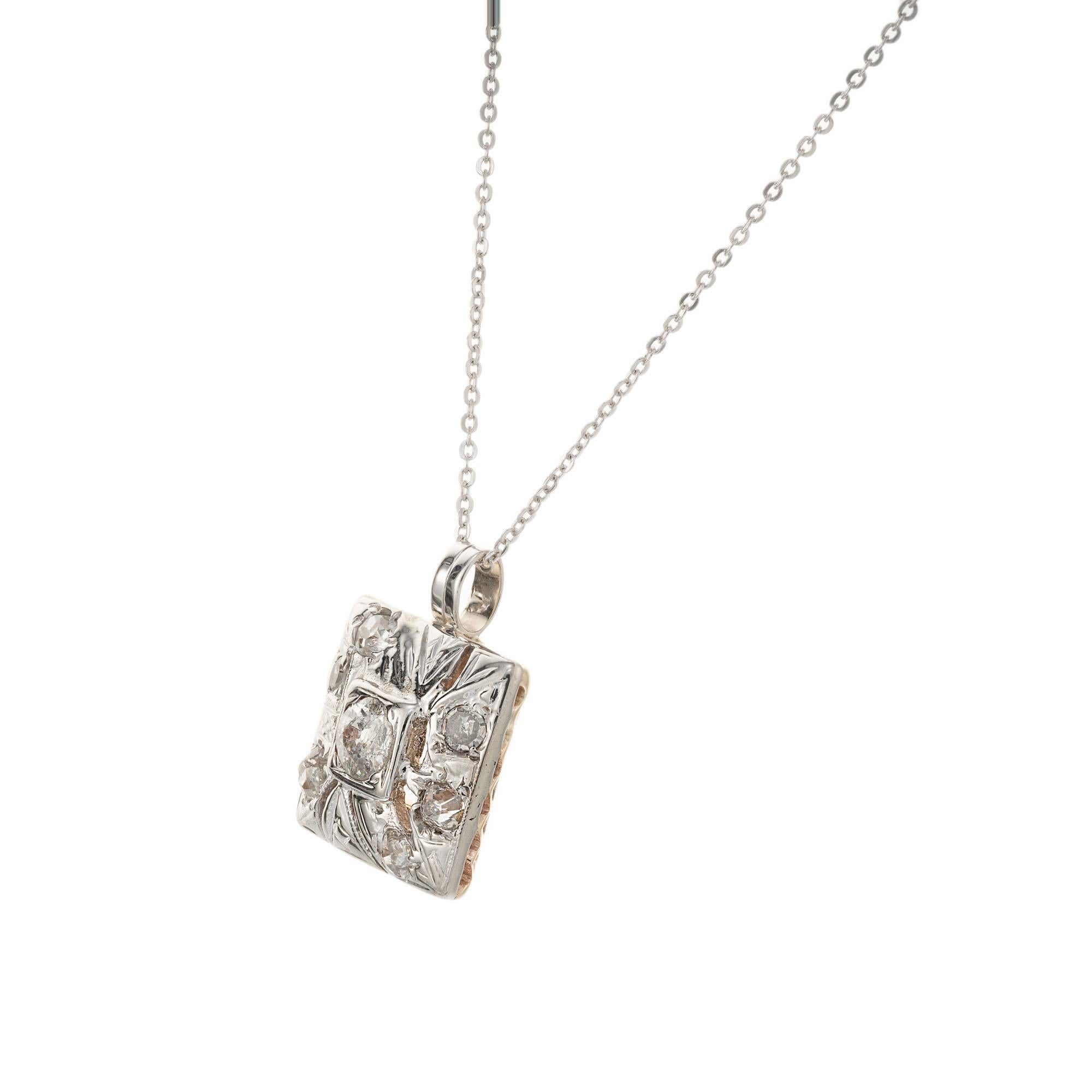 1920’s Art Deco pendant necklace. 1 old mine cut center diamond with 6 old mine cut accent diamonds in 14k white gold with yellow gold back setting. 16 inch chain.  

1 old mine cut diamond, J SI approx. .32cts
6 old mine cut diamonds, I-J SI