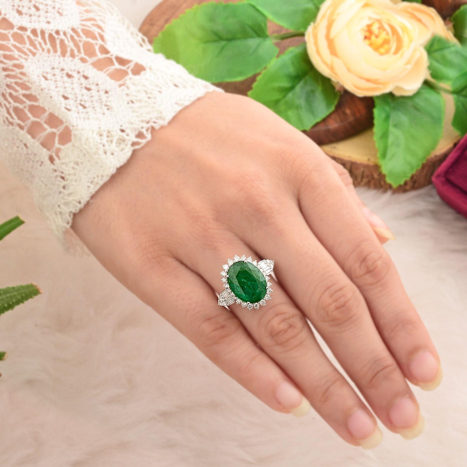 This ring has been meticulously crafted from 10-karat gold.  It is hand set with 5.6 carats emerald & .70 carats of sparkling diamonds. 

The ring is a size 7 and may be resized to larger or smaller upon request. 
FOLLOW  MEGHNA JEWELS storefront to