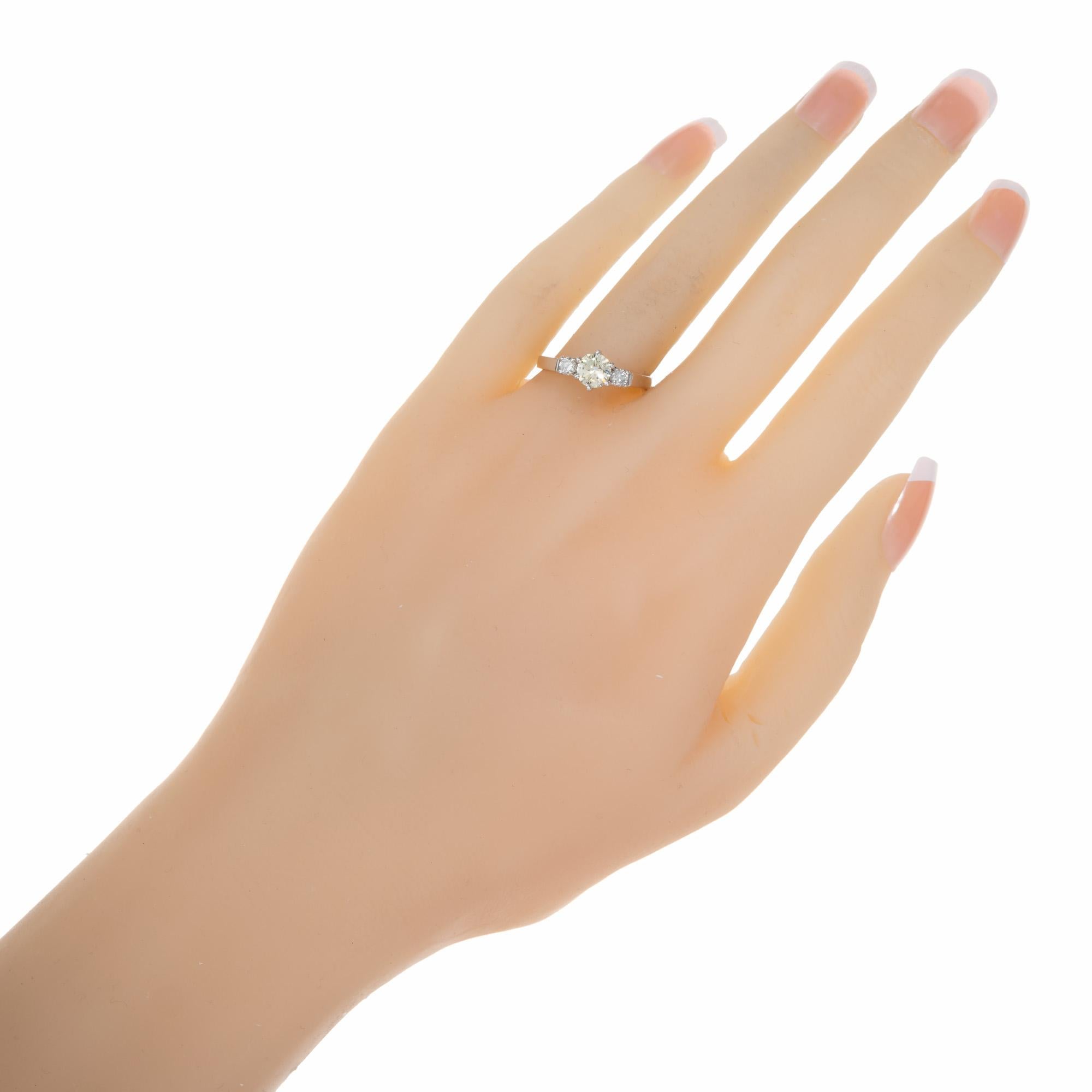 Women's .56 Carat Round Fancy Light Yellow Diamond Three-Stone Gold Engagement Ring For Sale