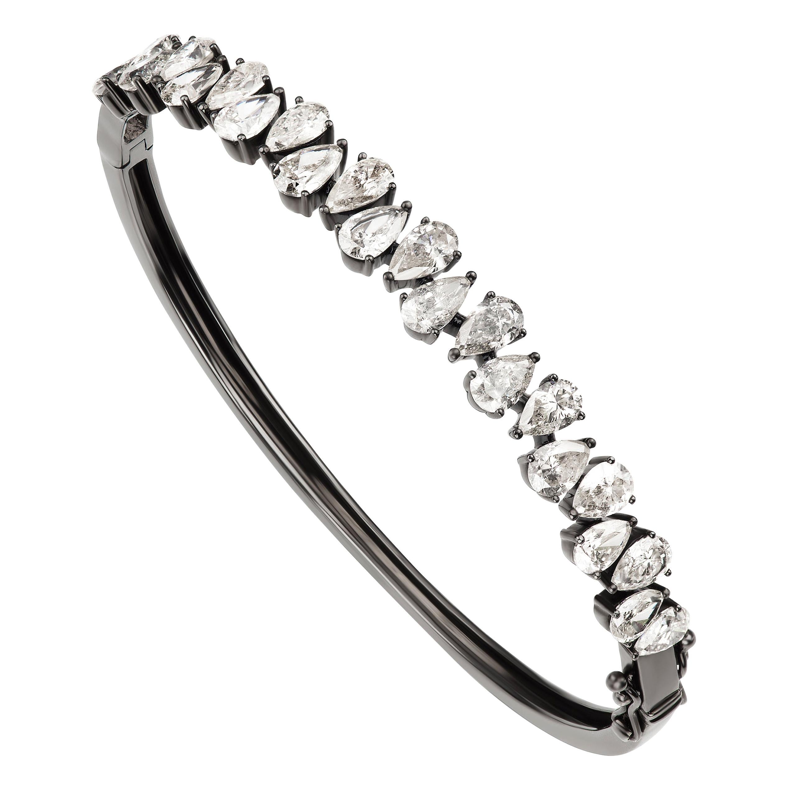 This Nigaam diamond bracelet is decorated with beautiful white diamonds on its 18K black gold metal body. There are 23 pcs of diamonds placed in the lovely bangle. The pear full cut white diamonds encrusted in this 18K black gold bangle are in a