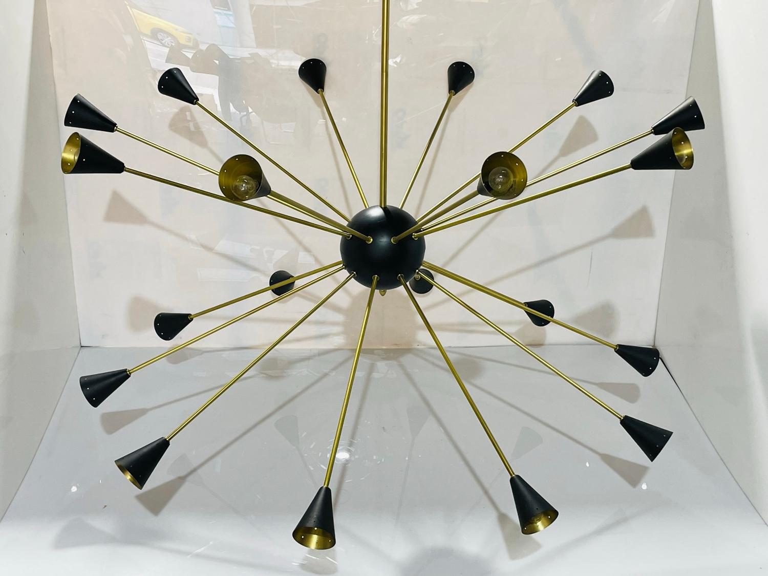 Very large Sputnik style chandelier in solid brass with black finish light shades and center ball.
The piece is very beautiful and imposing in person, the arms come off for easy transport/shipping.
Measurements:
66 inches high x 56 inches in