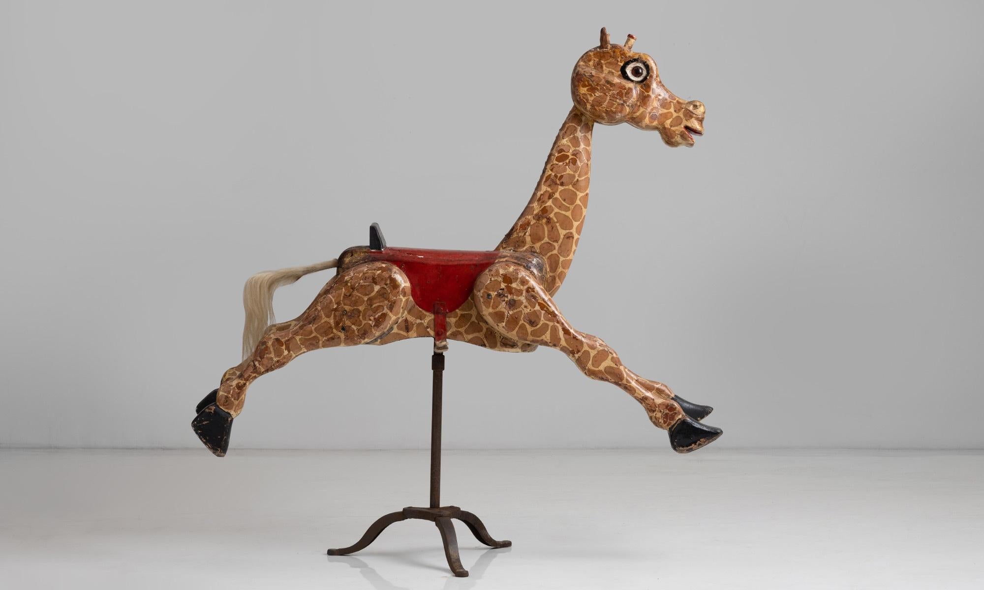 56 Inch tall Giraffe carousel ride.

England, circa 1920.

Carved wooden giraffe in original hand painted finish with large glass eyes.

Measures: 56”W X 12”D X 56.5”H.
 