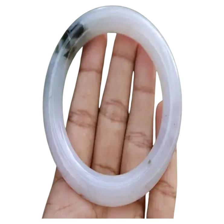 Type A Jadeite Jade Bangle

Bangles are one of the most popular forms of jadeite jewelry, symbolizing unity and eternity. Even today, it is widely believed in the Orient that a bangle will protect its wearer from disaster by absorbing negative