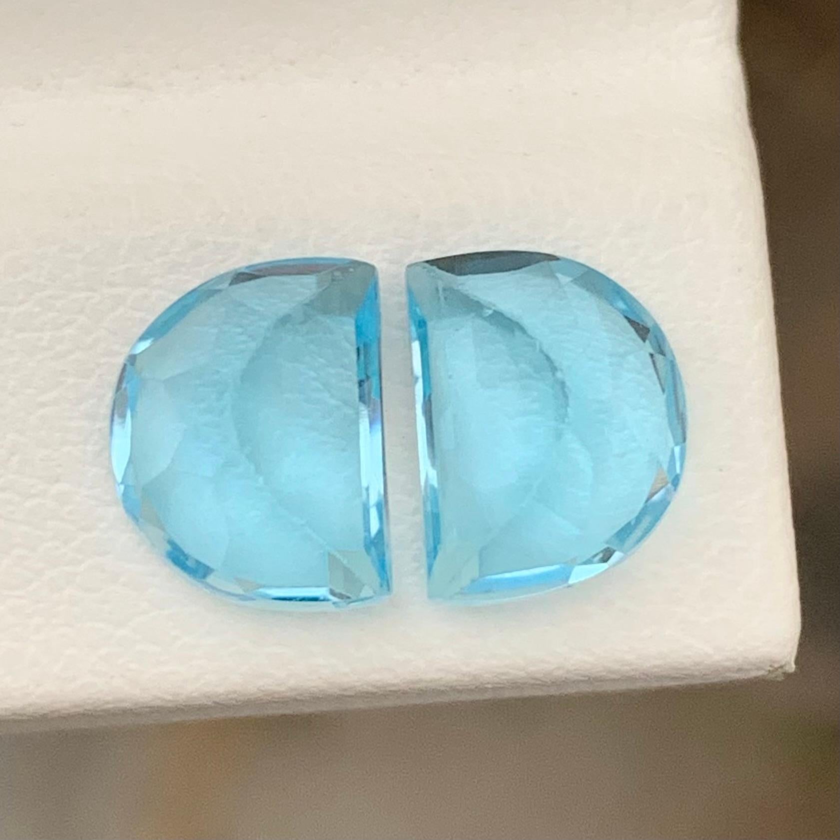 Half Moon Cut 5.60 Carat Brilliant Blue Topaz Pair Carving Gem For Earrings  For Sale