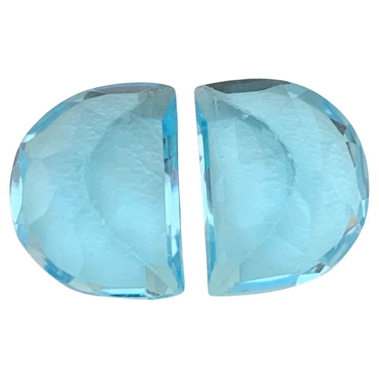 Loose Blue Topaz Pair
Weight: 5.60 Carats 
Dimension: 9.2 x 7.2 x 5.1 Mm
                    9.2 x 7.1 x 5.3 Mm
Origin: Brazil 
Colour: Blue 
Certificate: On Demand 
Shape: Crescent 

Blue topaz is a stunning gemstone prized for its vibrant blue