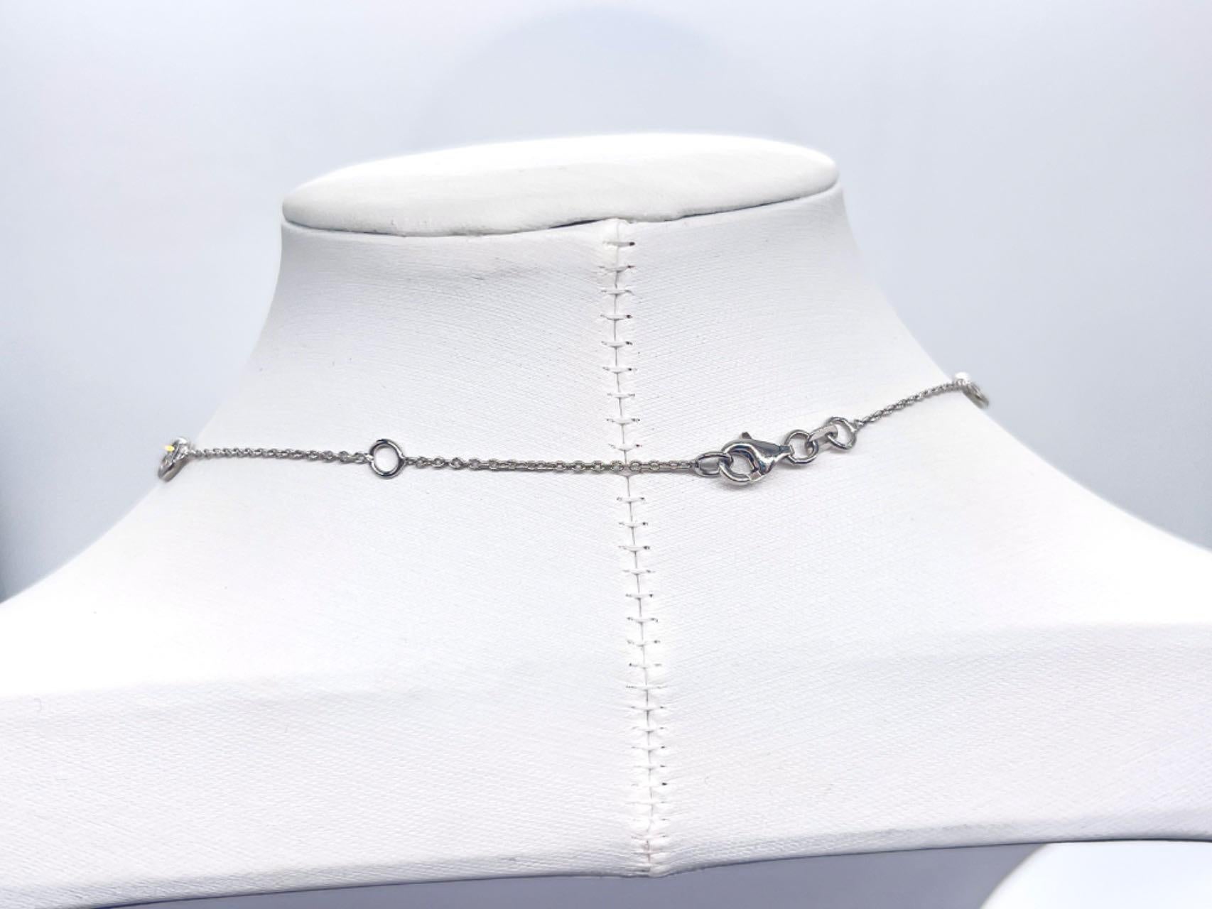 10 Station Diamond by the yard necklace set in Italian made 14K white gold. 

Total diamond size: 5.60cts

Beautiful and shiny stones! 
Length: 17 inch 
Weight: 6.83 grams of solid gold
Color: G
Clarity Range: SI-I
All Natural Diamonds!

*Free
