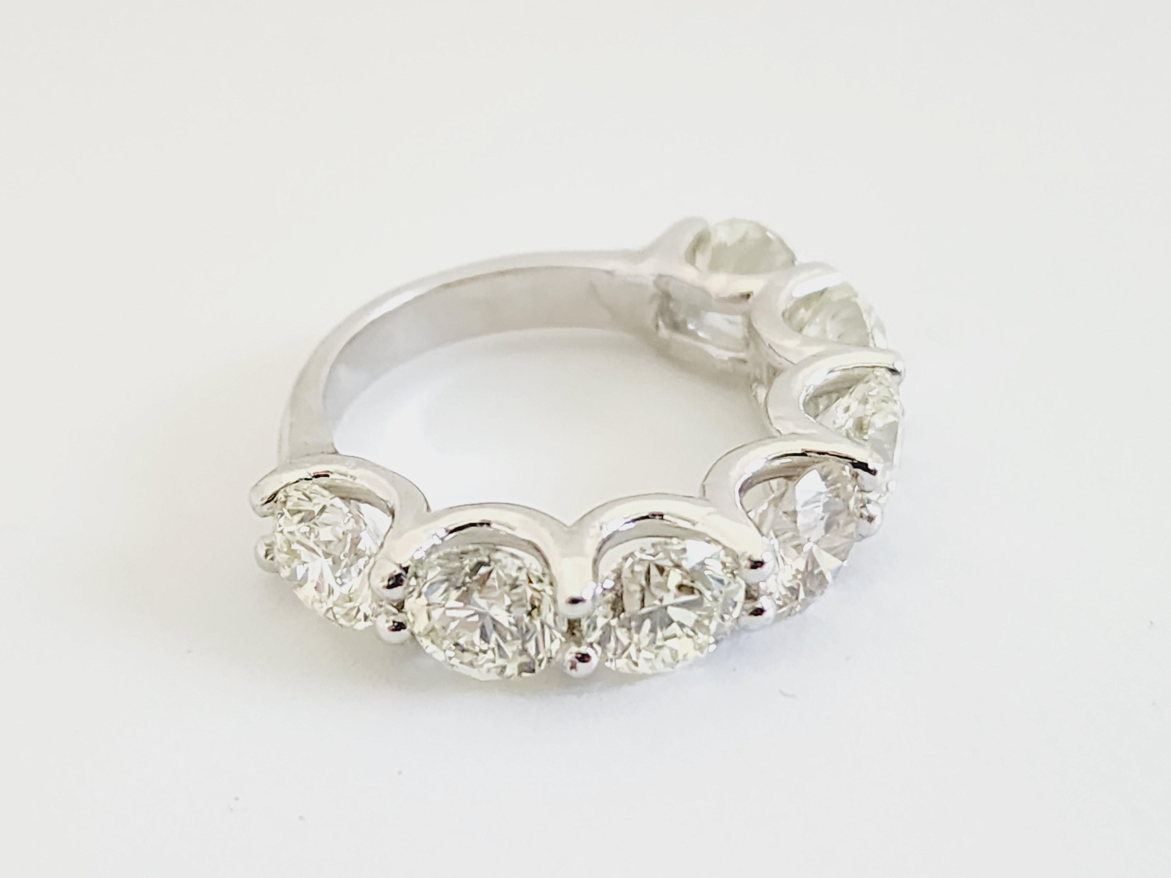 Beautiful 5.60 Carats Diamond Band White Gold 14 Karat, 
7 Pieces of Natural Diamonds, Average I-J Color Clarity VVS,
Ring Size 6