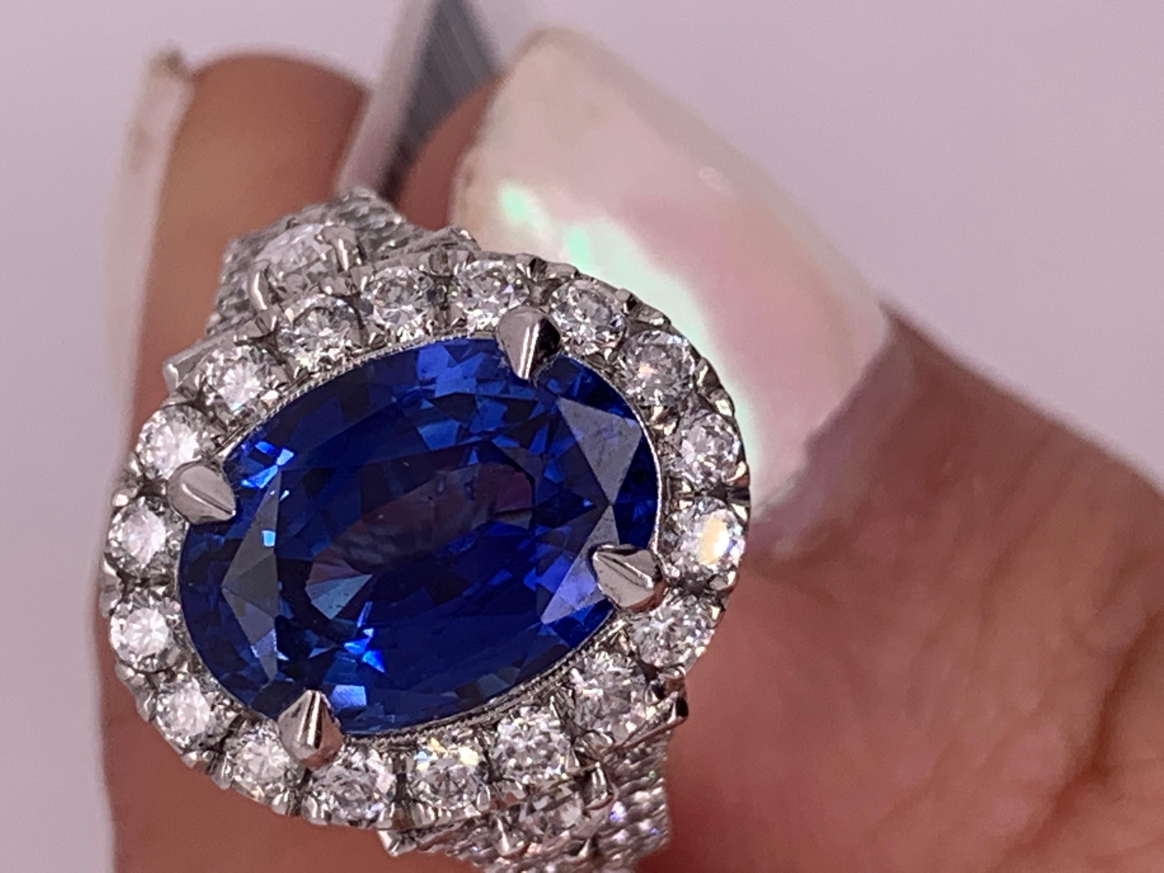 Oval Cut 5.60 Carat Oval Blue Sapphire and Diamonds Fashion Ring in 18 Karat White Gold For Sale