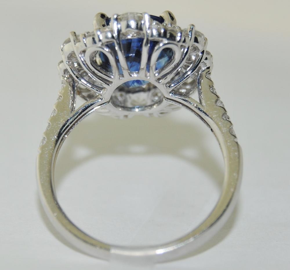 Oval Cut 5.60 Carat Sapphire and 1.44 Carat Diamond Ladies Ring in 18 Karat White Gold For Sale