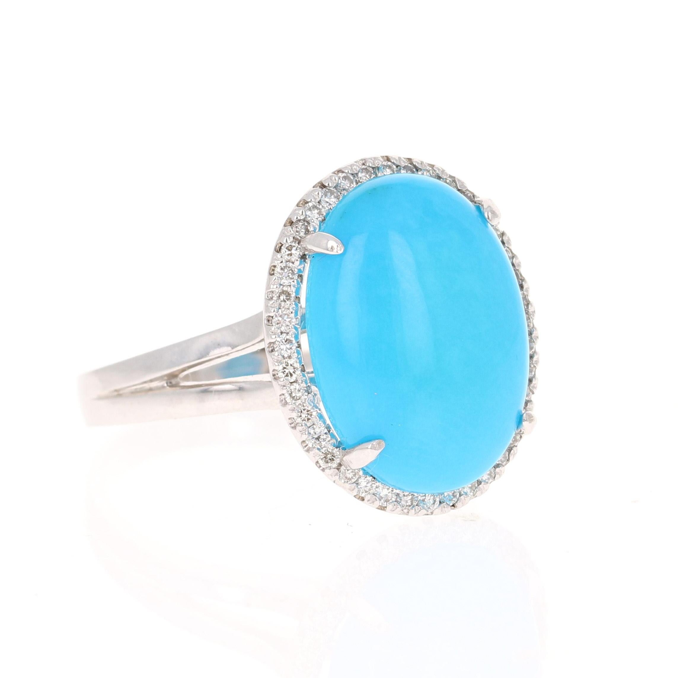 The Oval Cut Turquoise is 5.37 carats and measures at 12 mm x 16 mm. It is surrounded by 40 Round Cut Natural Diamonds that weigh 0.23 carats. (Clarity: VS, Color: H)
The total carat weight of the ring is 5.60 carats. 
The ring is crafted in 14