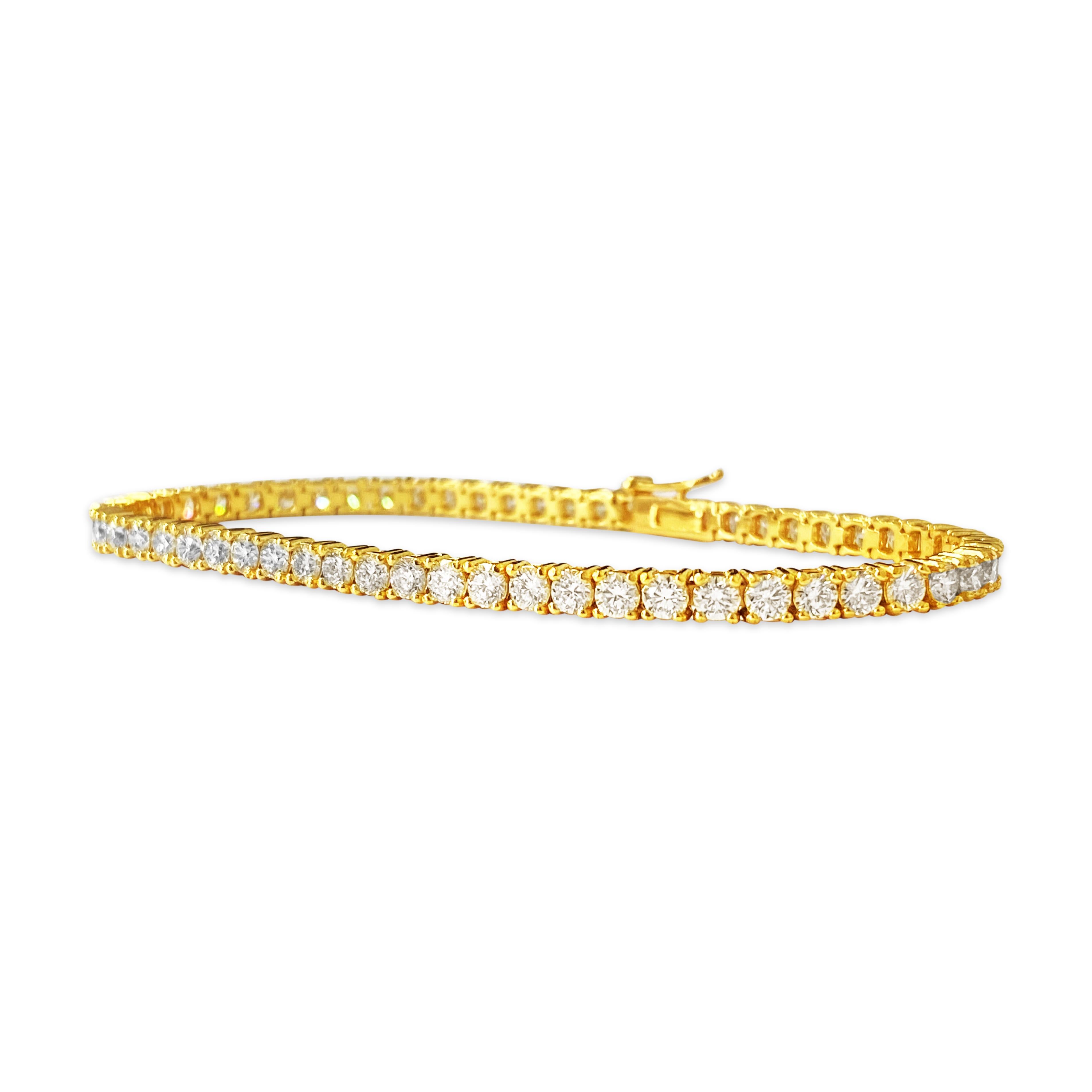 Metal: 14k yellow gold. 
Diamonds: 5.60 cwt. 
VVS clarity. H color. 
Round brilliant cut. 
57 stones total. 100% natural earth mined diamonds set in prongs. 
7 inches long. 
Brand new unisex diamond tennis bracelet. Custom made piece. Premium