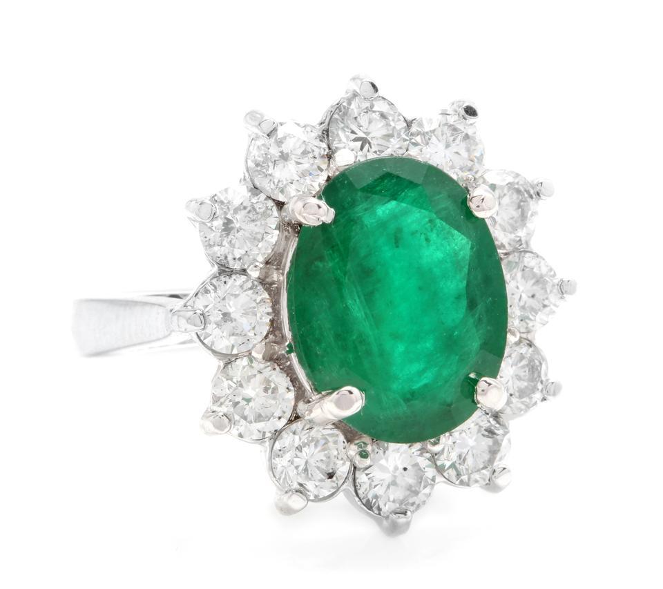 5.60 Carats Natural Emerald and Diamond 14K Solid White Gold Ring

Suggested Replacement Value: $8,200.00

Total Natural Green Emerald Weight is: Approx. 3.80 Carats (transparent)

Emerald Measures: 11 x 9mm

Natural Round Diamonds Weight: Approx.