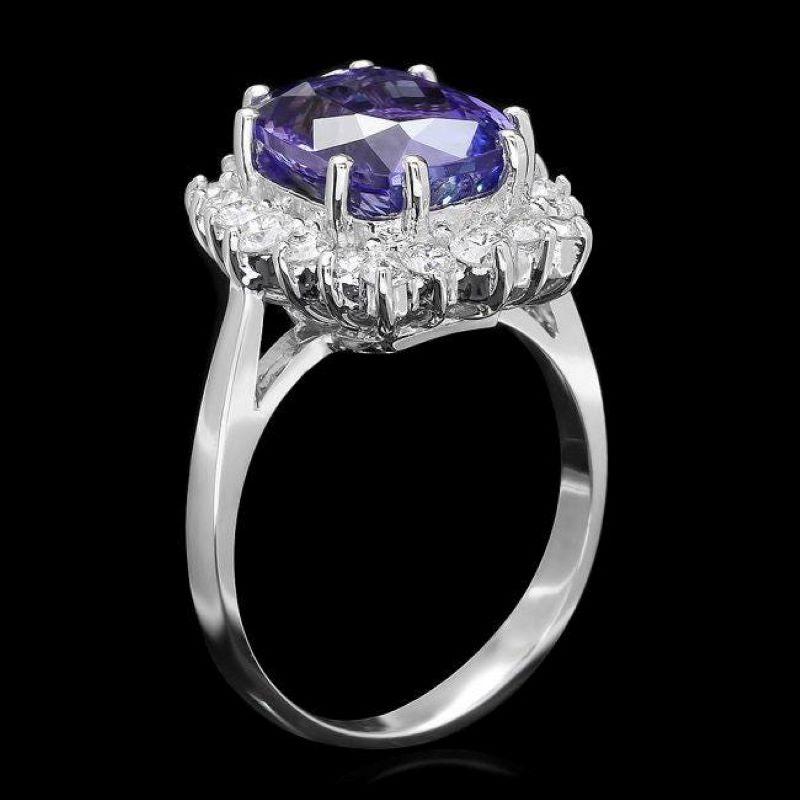 5.60 Carats Natural Tanzanite and Diamond 14K Solid White Gold Ring

Total Natural Tanzanite Weight is: Approx. 4.80 Carats 

Tanzanite Measures: Approx. 11.00 x 9.00mm

Natural Round Diamonds Weight: Approx. 0.80 Carats (color G-H / Clarity