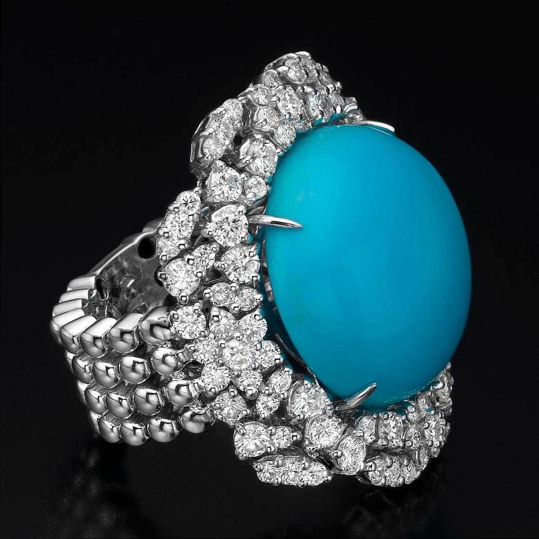 This gorgeous blue Turquoise ring  will impress everyone around you. It features a  5.60 carat round shape gemstone, adorned with 2.87 carat natural diamonds.

Ring : 18K white gold, .15.70 gr.

Main stone:
Round Cabochon Turquoise 
Number: 1
Carat: