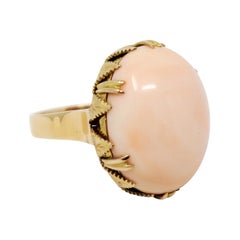 56.00 Carat Oval Cabochon Coral Cocktail Ring with Leaf Detail in 14 Karat Gold 56.00 Carat Oval Cabochon Coral Cocktail Ring with Leaf Detail in 14 Karat Gold