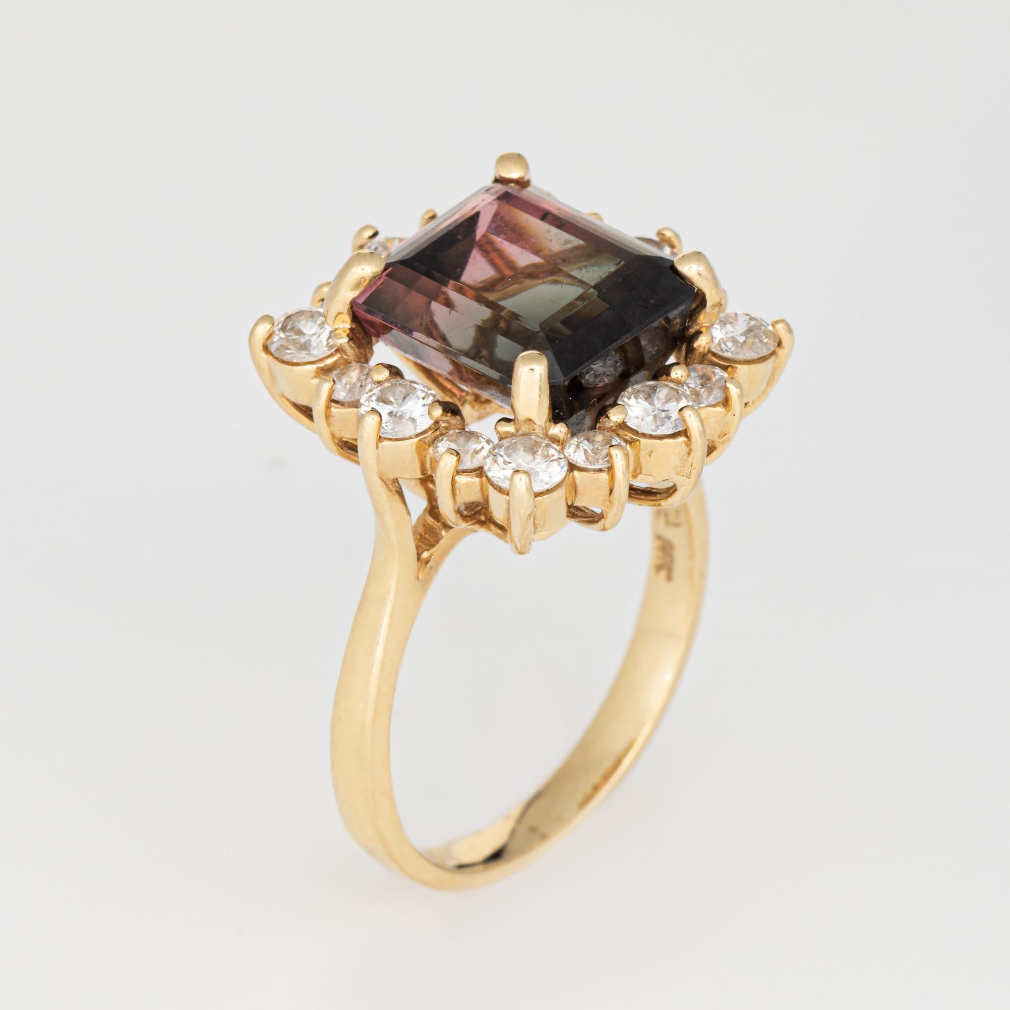 Stylish vintage bi-color tourmaline cocktail ring (circa 1980s) crafted in 14k yellow gold. 

Emerald cut bi-color tourmaline 10.5mm x 10mm (estimated at 5.60 carats). 16 diamonds total an estimated 1.35 carats (estimated at I-J color and SI1-I1