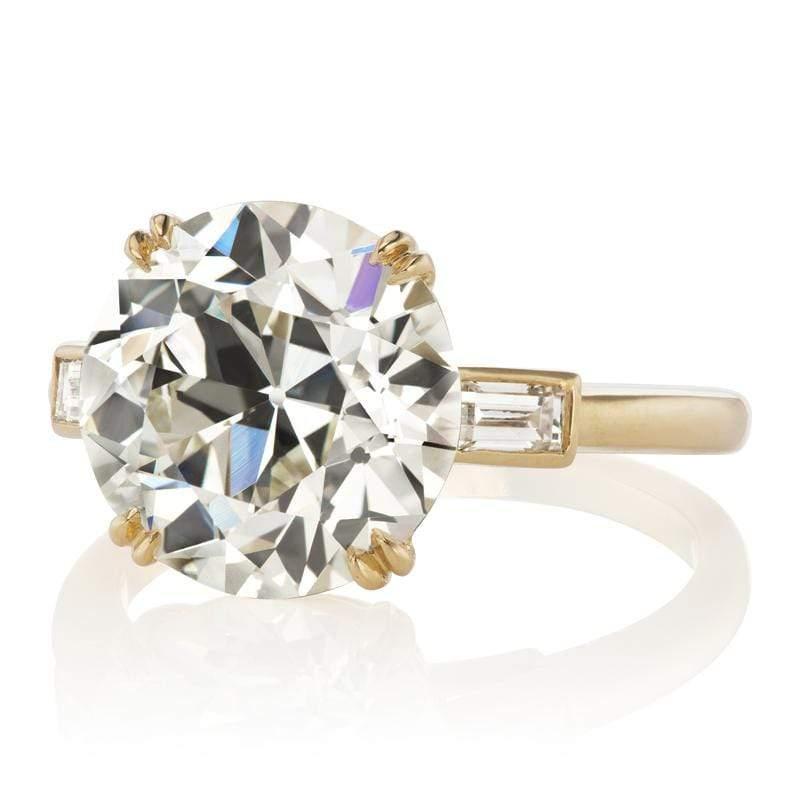 This ring is a VB original made right here in NYC centering an authentically antique diamond. The ring centers a GIA certified 5.61-carat old European cut diamond of L color, VS2 clarity. The stone is set in a 4 double prong 18-karat yellow gold