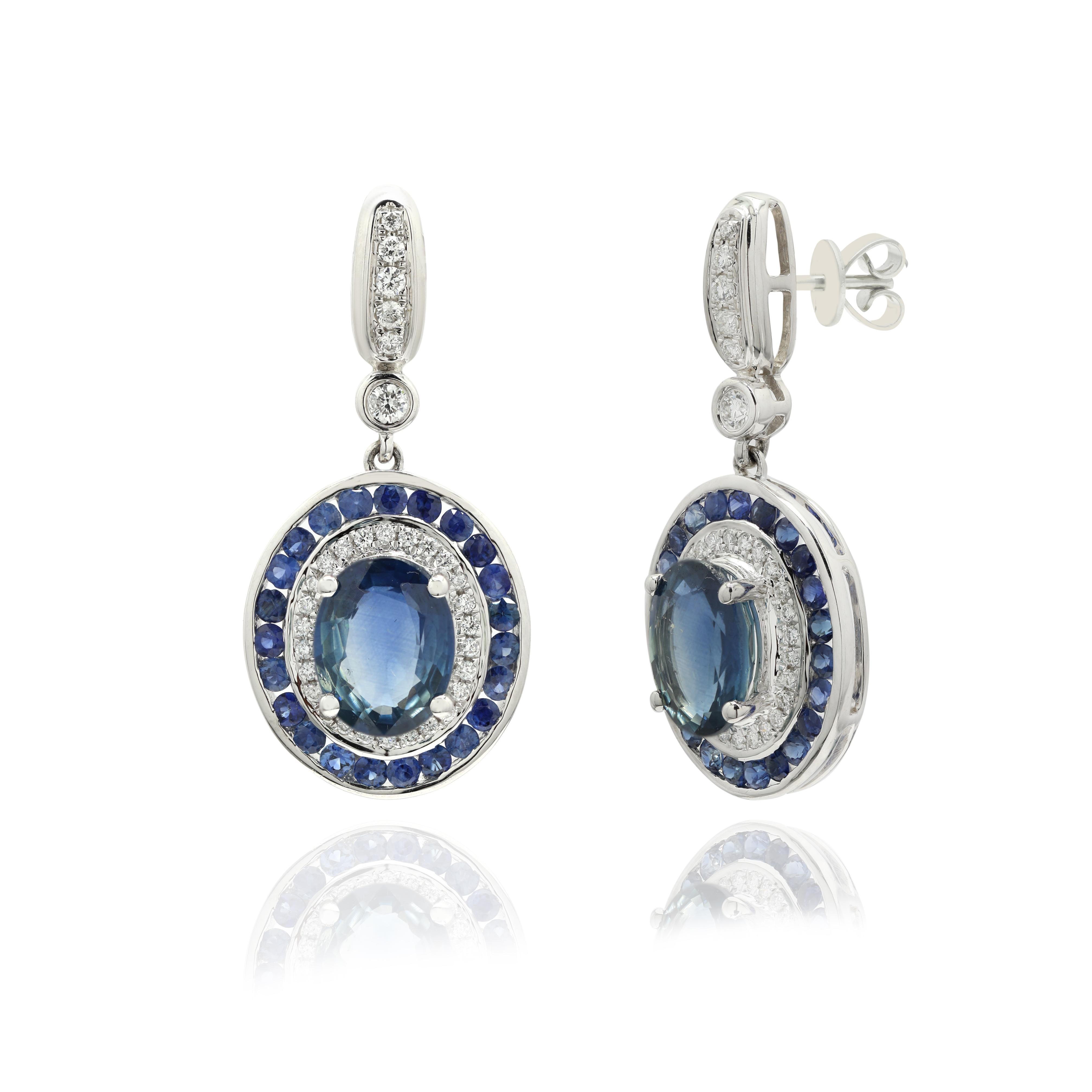 Blue Sapphire Dangle earrings to make a statement with your look. These earrings create a Sparkling, luxurious look featuring oval and round cut gemstone.
If you love to gravitate towards unique styles, this piece of jewelry is perfect for