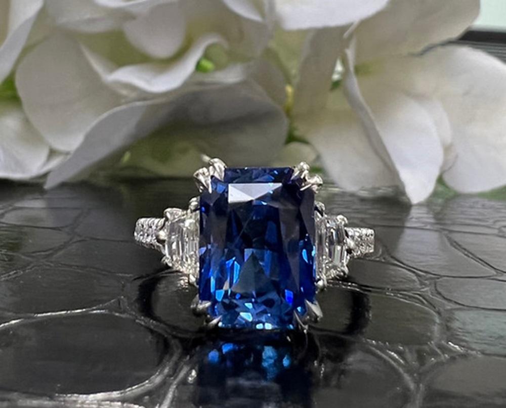 Sapphire Weight: 5.61 CTS, Measurements: 10.6 x 8.5 mm, Diamond Weight: 0.66 CT, Metal: Platinum, Ring Size: 7, Shape: Emerald-Cut, Color: Blue, Hardness: 9, Birthstone: September, Certificate: CD Certified
