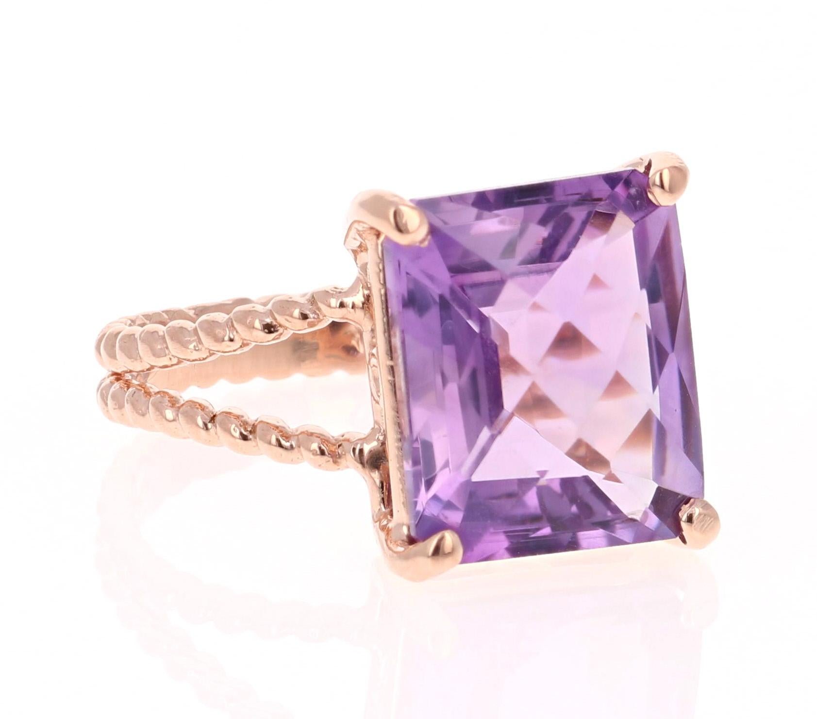 This beautiful and simple ring has a bright and vivid Emerald Cut Amethyst in the center that weighs 5.62 carats. 
The setting is beautifully crafted in 14K Rose Gold and weighs approximately 3.2 grams.
The ring is a size 7 and can be re-sized if