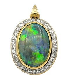 5.62 Carat Oval Cut Opal and Diamond Halo Pendant in 14 Karat Yellow Gold