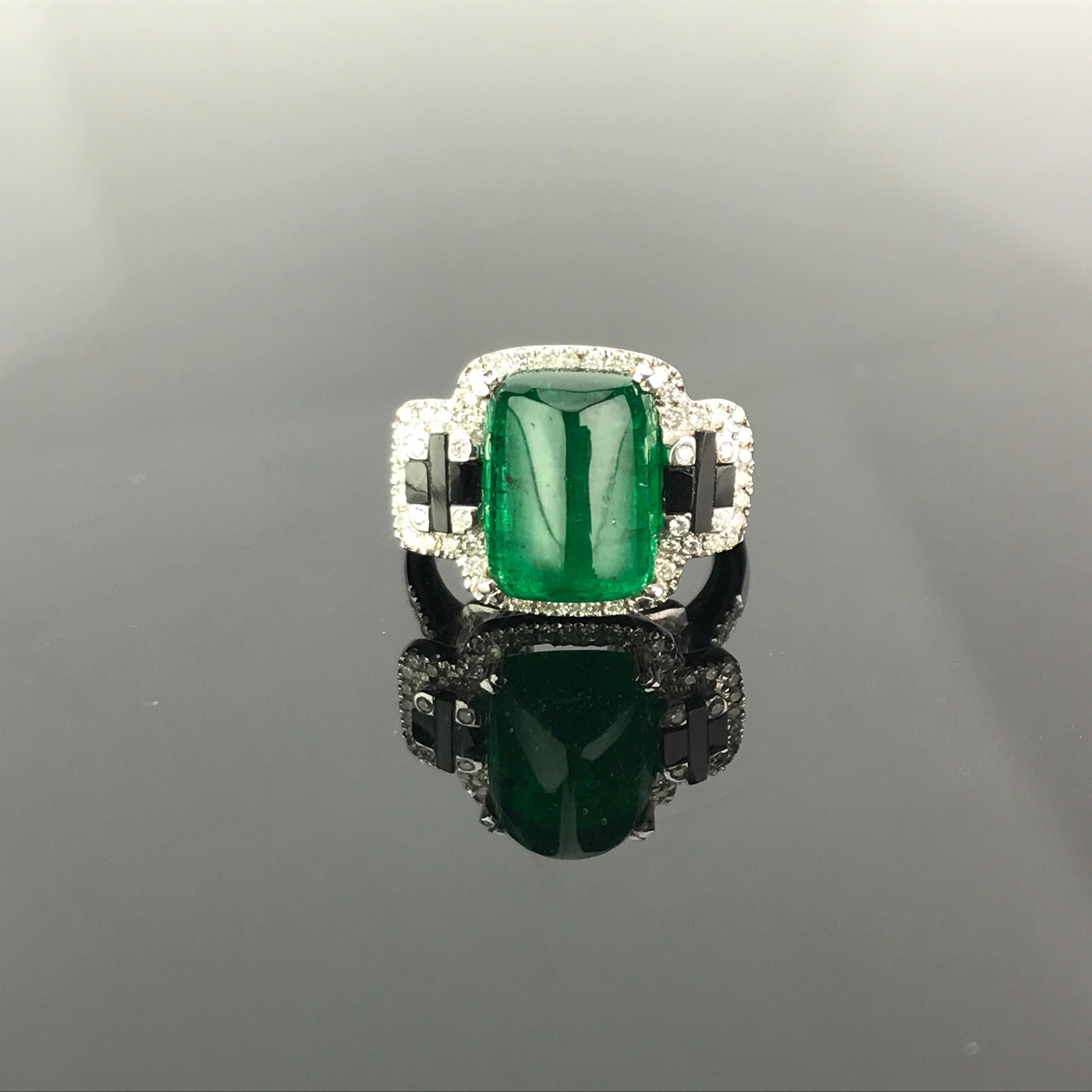 One of a kind cocktail ring using, transparent  5.62 carat Zambian Emerald with great lustre and beautiful colour adorned with Black Onyx and Diamonds. Currently a ring size US 6, but we can resize the ring for you without additional cost.