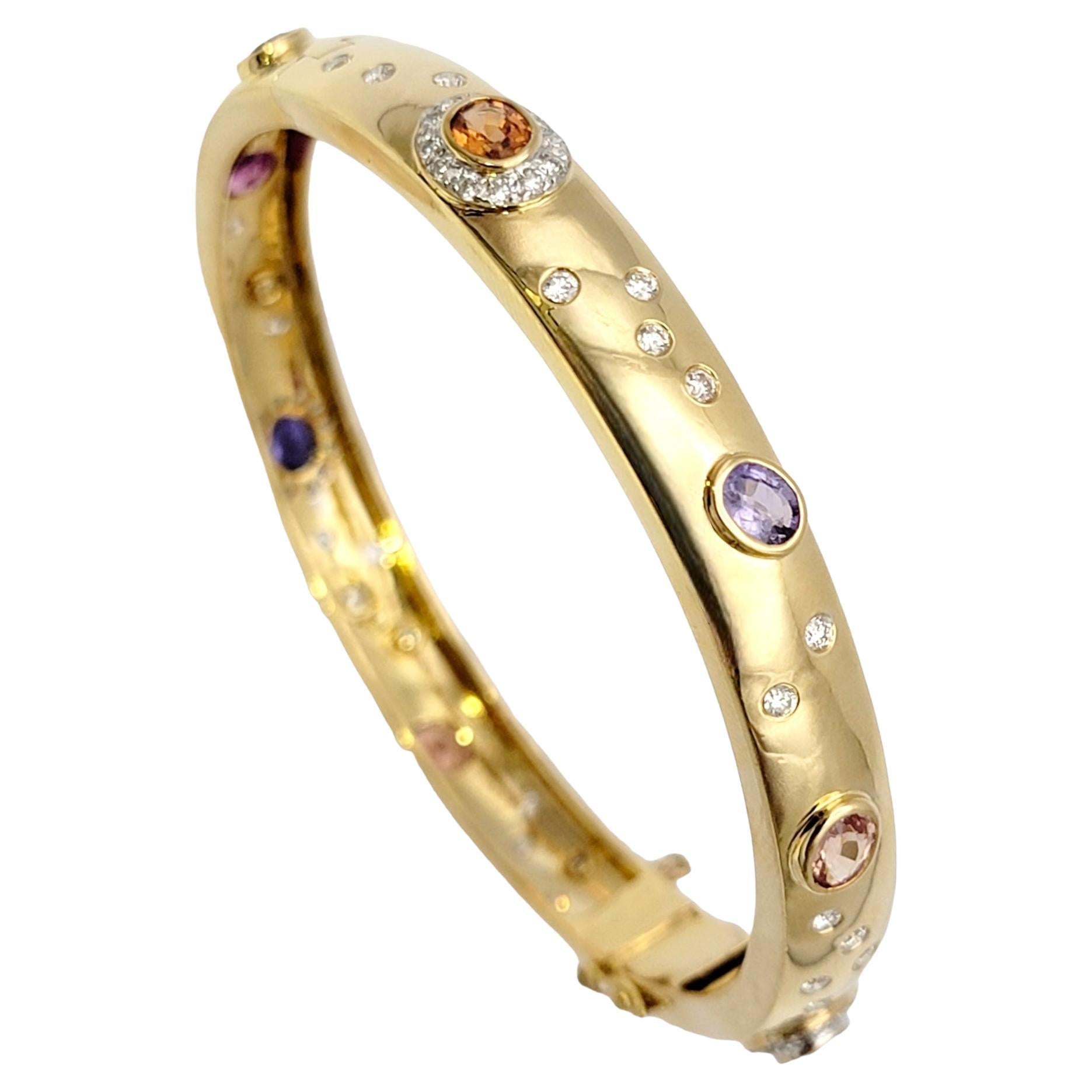 You will absolutely fall in love with this luxurious and captivating bangle bracelet adorned with radiant diamonds and mesmerizing multi-colored sapphires. Crafted with meticulous attention to detail, this enchanting piece embodies elegance,