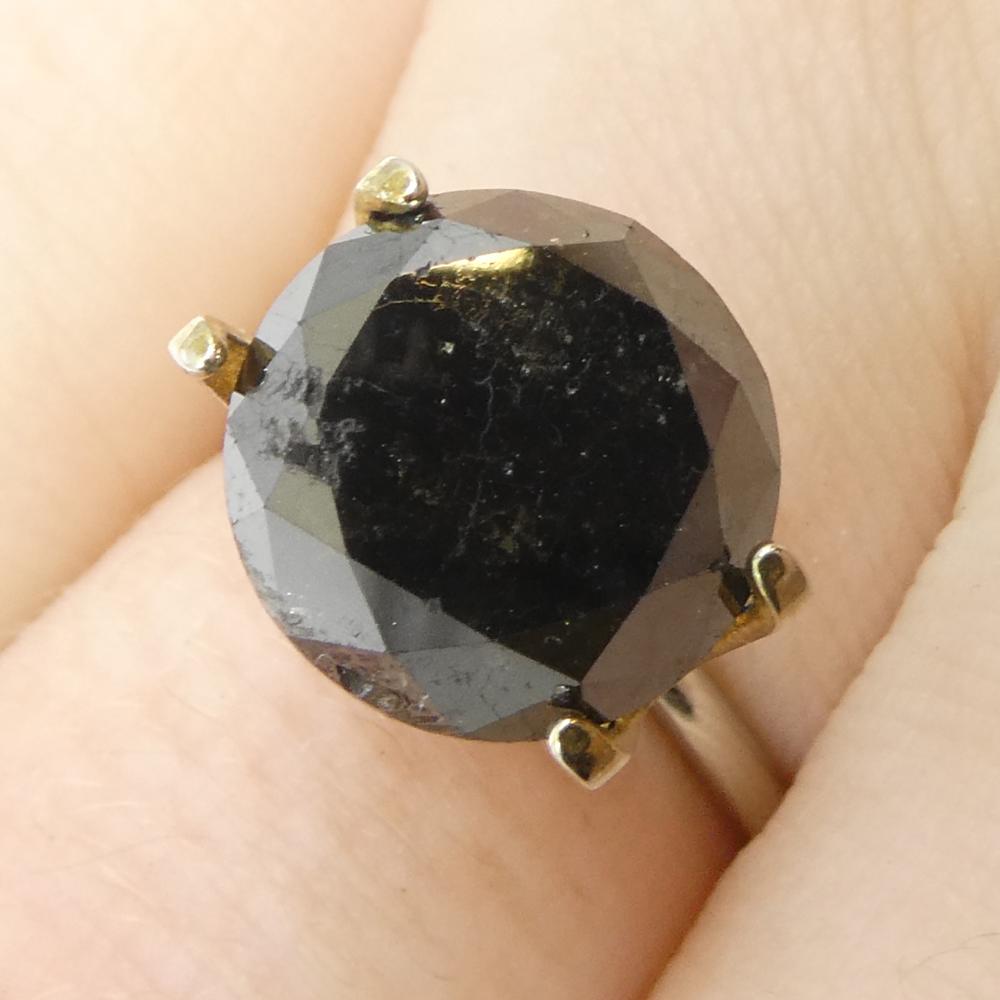 Description:

Gem Type: Diamond 
Number of Stones: 1
Weight: 5.62 cts
Measurements: 10.53 x 10.53 x 7.35 mm
Shape: Round
Cutting Style Crown: Brilliant Cut
Cutting Style Pavilion: Brilliant Cut 
Transparency: Opaque
Clarity: N/A
Colour: Black
Hue: