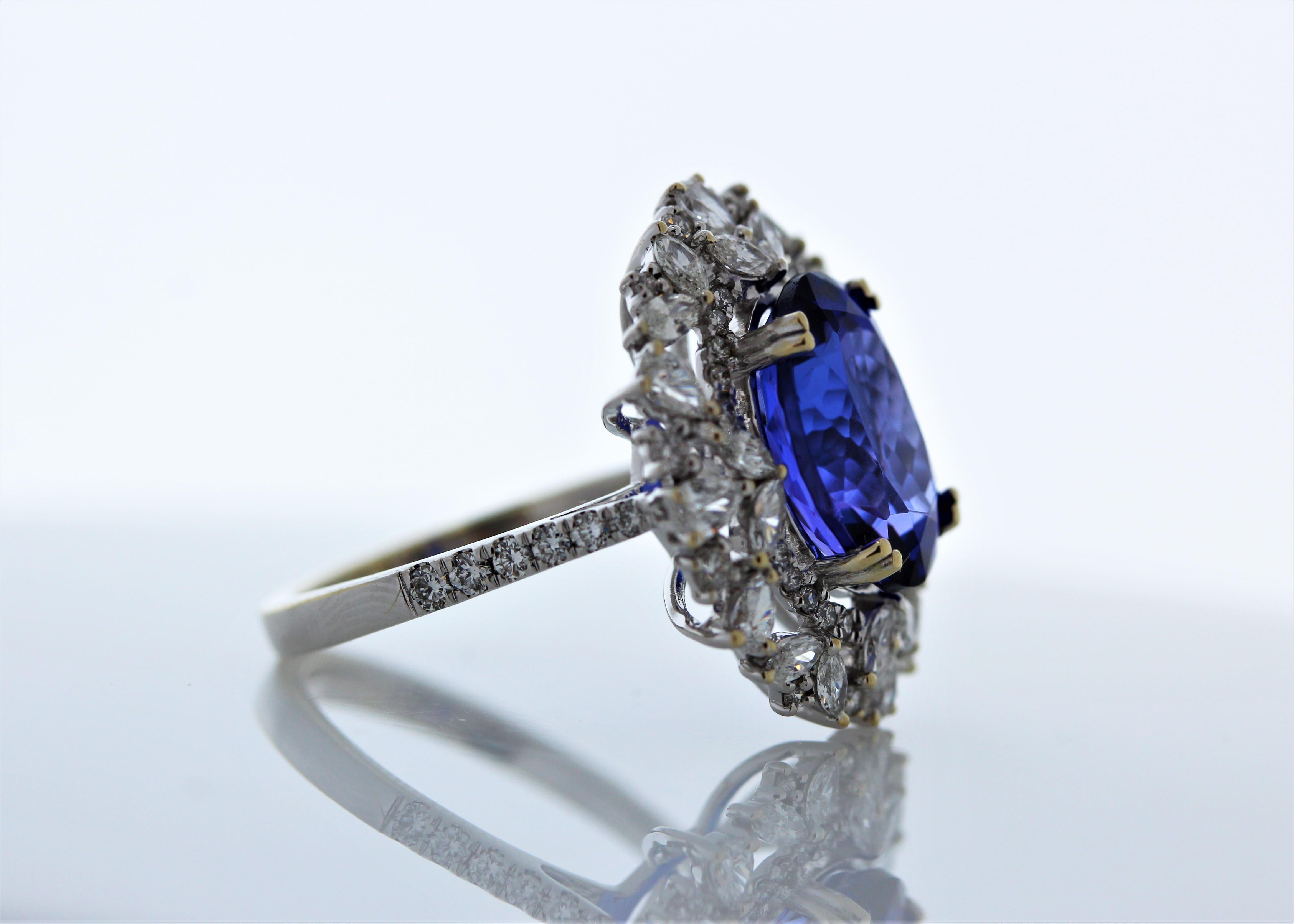 Designed with luxury in mind, this gorgeous cocktail ring showcases an 5.62carat oval cut tanzanite that exhibits a deep bluish-purple color. This gem source is near the foothills of Mt. Kilimanjaro in Tanzania. Its transparency and luster are