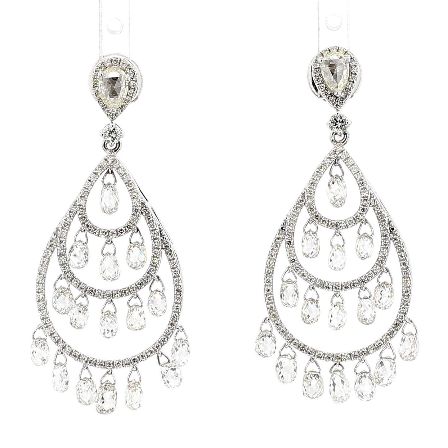 The Iris Fine Jewelry drop earrings are a captivating creation, showcasing 5.63 carats of white briolette diamonds with a clarity of VS2 and a color grade of F. Complemented by 1.16 carats of round white diamonds, these earrings exude elegance. The