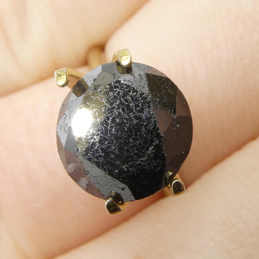 Description:

Gem Type: Diamond 
Number of Stones: 1
Weight: 5.63 cts
Measurements: 10.28 x 10.28 x 7.99 mm
Shape: Round
Cutting Style Crown: Brilliant Cut
Cutting Style Pavilion: Brilliant Cut 
Transparency: Opaque
Clarity: N/A
Colour: Black
Hue: