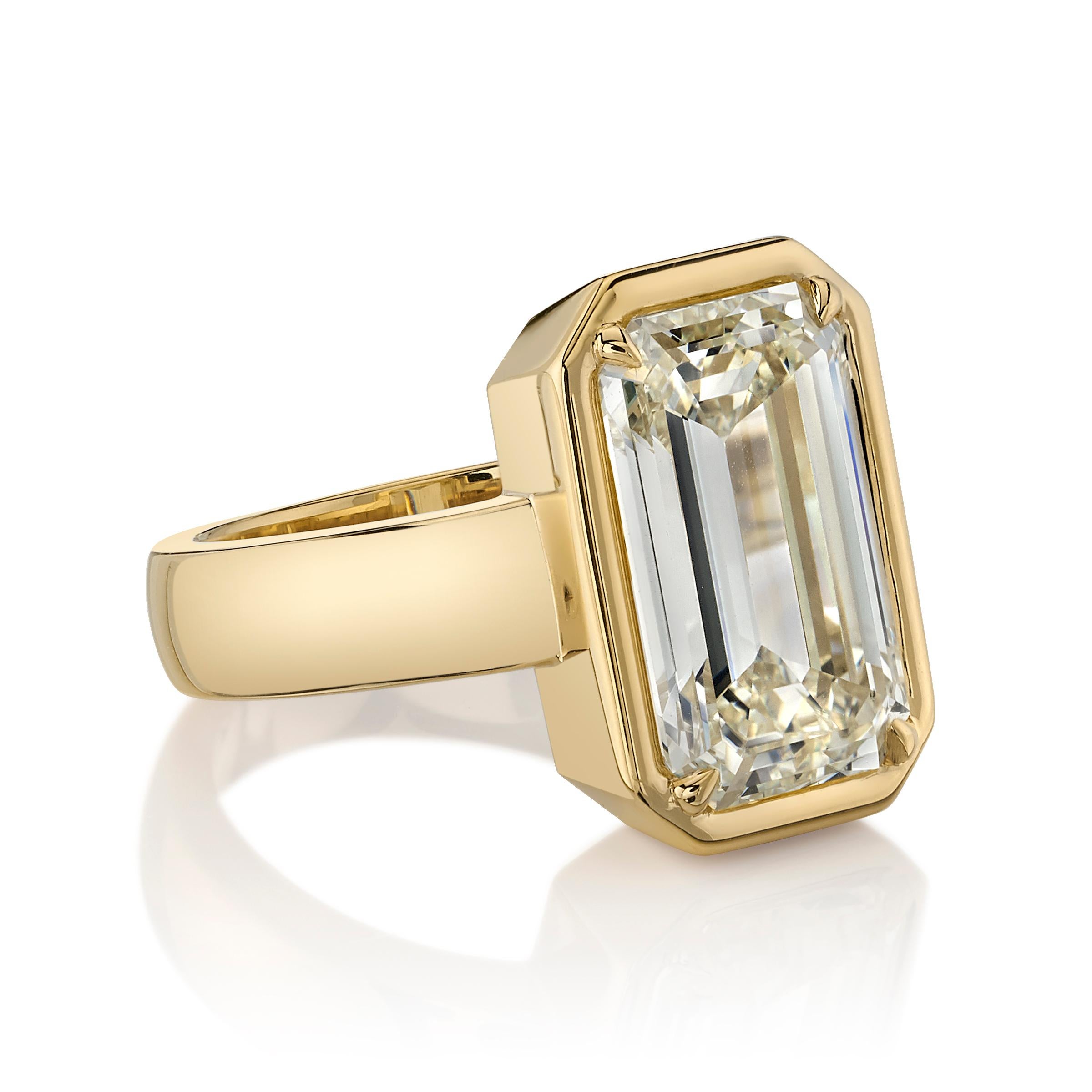 5.64ctw W-X/SI1 GIA certified Emerald cut diamond set in a handcrafted 18K yellow gold mounting.

Ring is a size 6 and can be sized to fit.