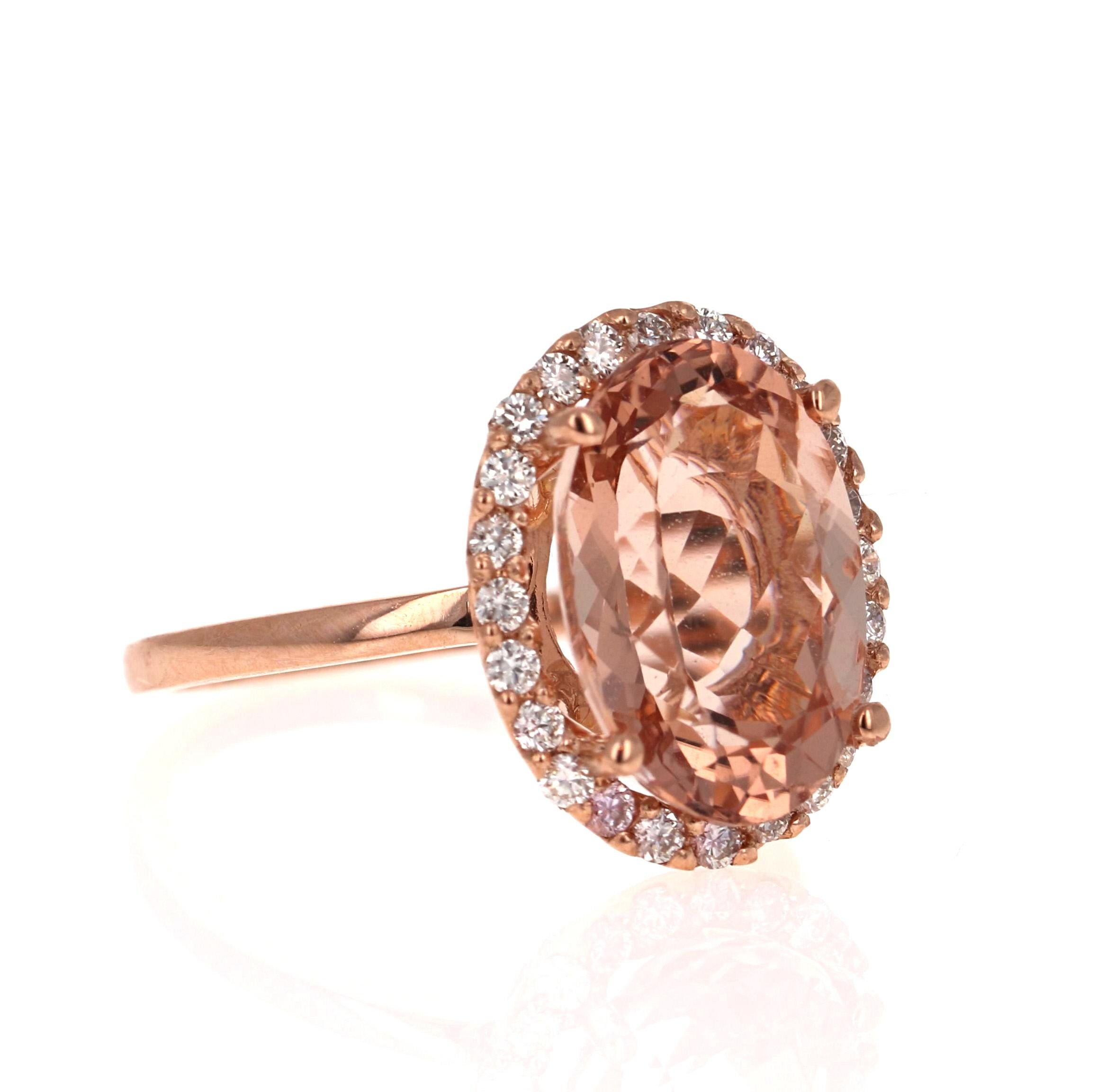 This Morganite ring has a beautiful 5.24 Carat Oval Cut Morganite and is surrounded by a simple halo of  24 Round Cut Diamonds that weigh 0.40 Carats.  The diamonds have a clarity of VS2 and a color of H. The total carat weight of the ring is 5.64