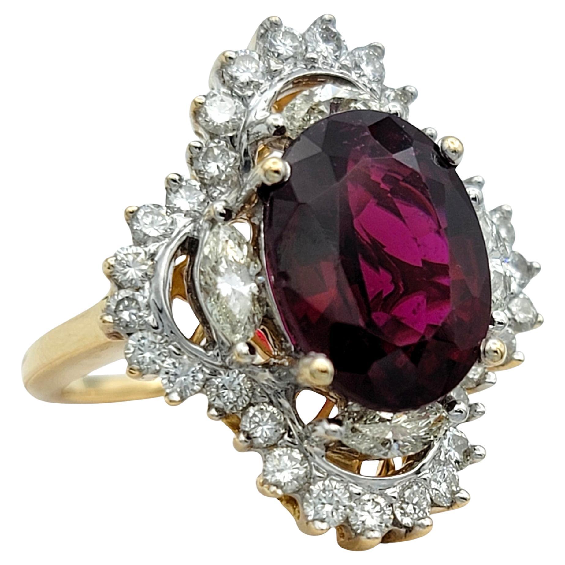 Ring Size: 8

Make a bold statement with this extraordinary cocktail ring, featuring a stunning rubellite tourmaline centerpiece. Set in a luxurious combination of 14 karat yellow and white gold, the unique design highlights a captivating oval-cut