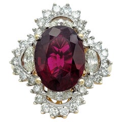 Anillo de cóctel de oro de 14 quilates con turmalina rubelita de talla oval de 5,64 quilates y diamantes