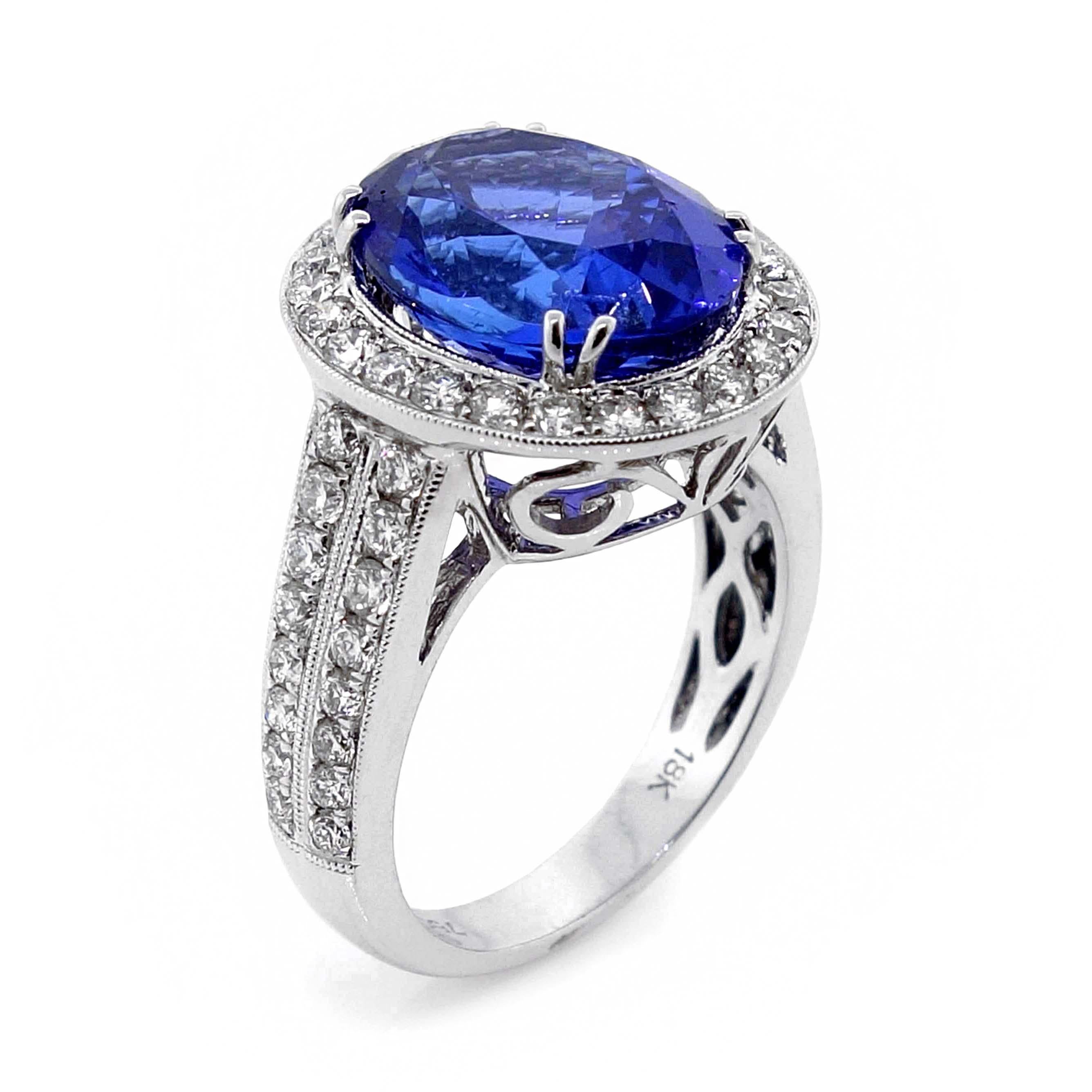 Ring with one oval tanzanite of about 5.65 carats measuring 12.28×9.70×6.74mm. The tanzanite is surrounded by 56 round brilliant cut diamonds of about 1.03 carats with a clarity of SI and color G. All stones are set in 18k white gold. The total