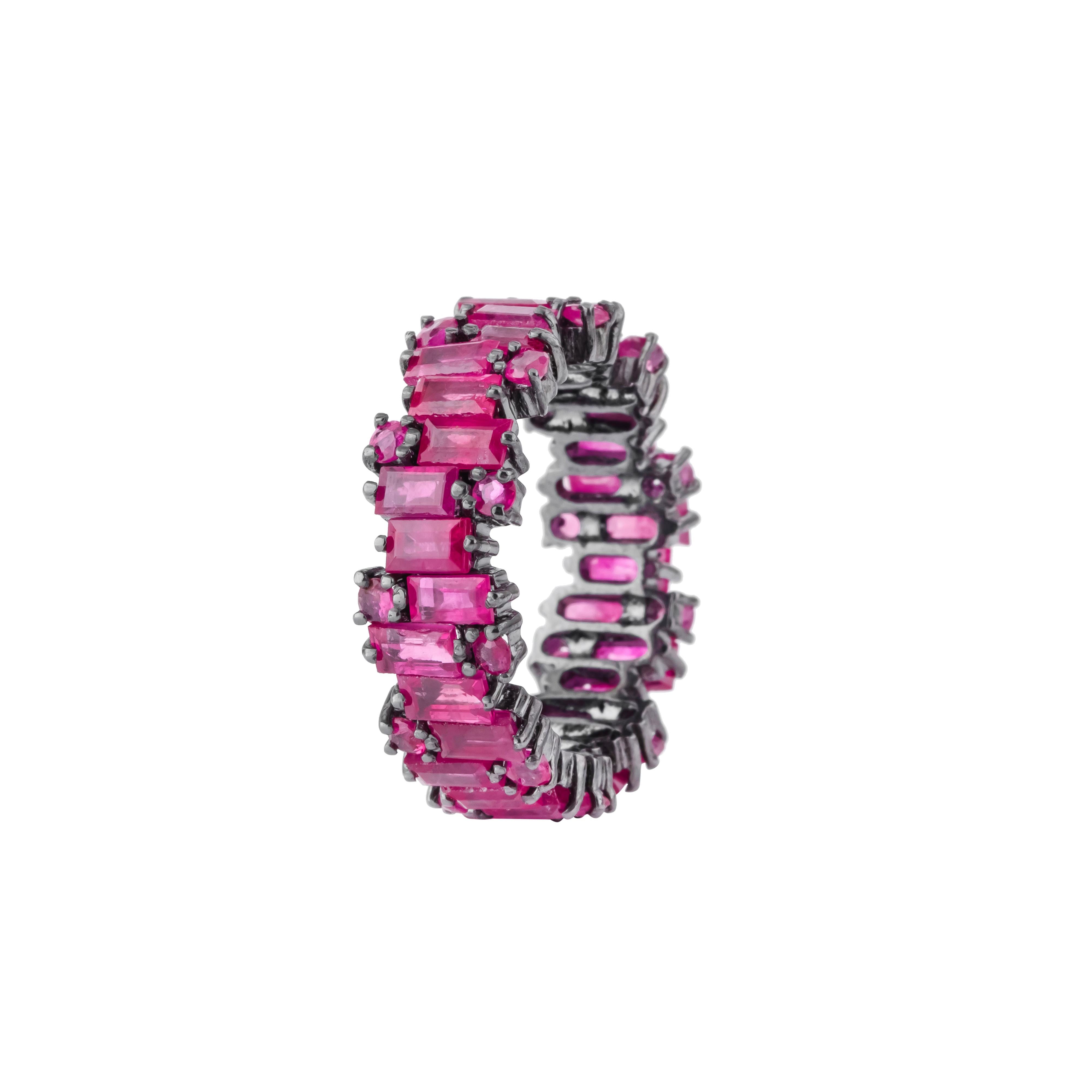 The 5.65 Carat Ruby Infinity Band Ring is a striking fusion of timeless elegance and vibrant color. This meticulously crafted piece showcases a continuous loop of exquisite rubies, each carefully selected for their rich red hue and captivating