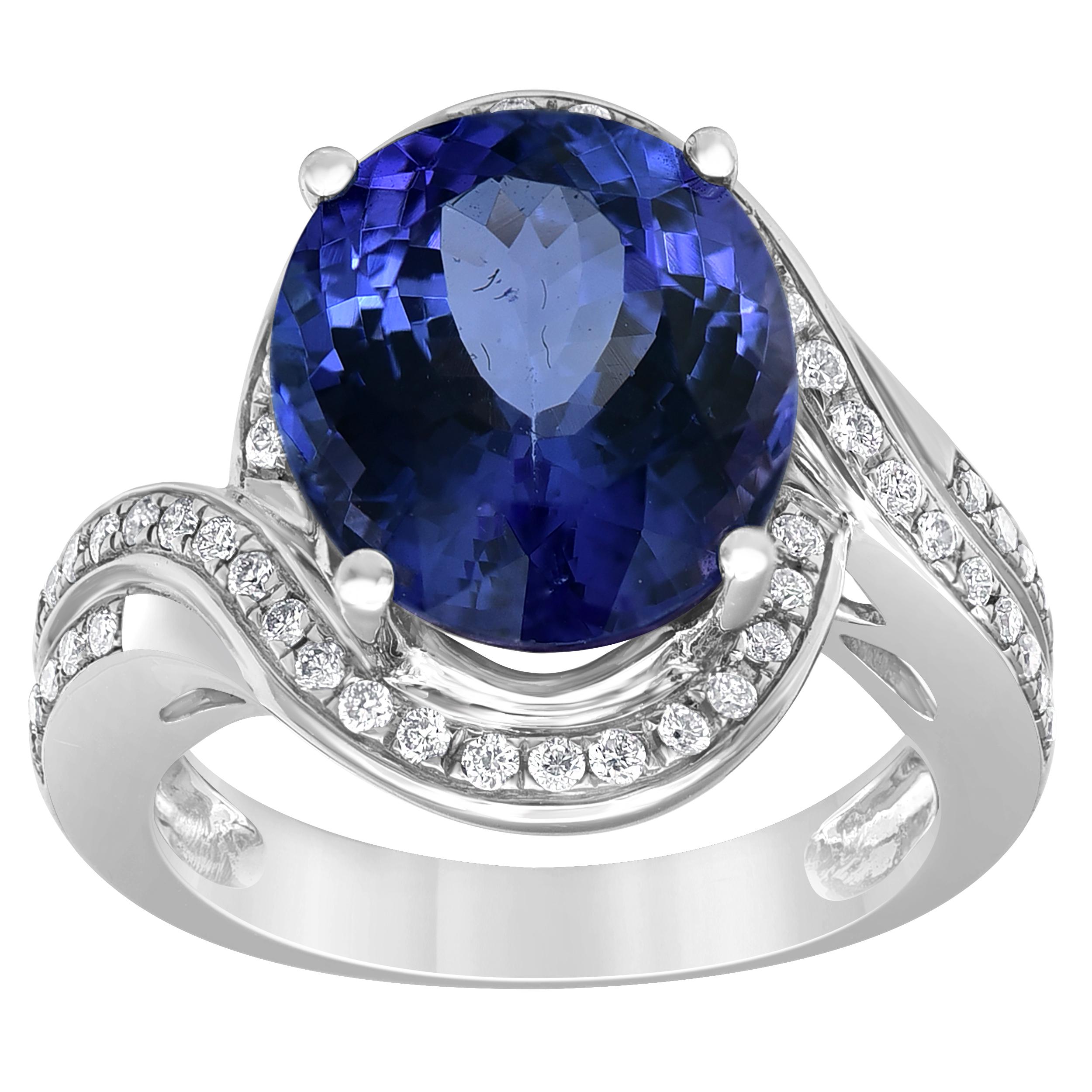 This elegant engagement ring features a gorgeous Prong-set Oval Shape Blue Tanzanite in a Centred. The diamond accents (Color- I, Clarity - I2) set along these wrapped edges provide a great contrast to the rich colour of this Tanzanite Stone. While