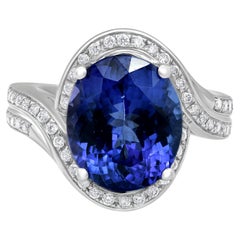 Anello con tanzanite da 5,65 carati e diamante da 0,35 carati in oro bianco 14 carati con incastonatura a forchetta