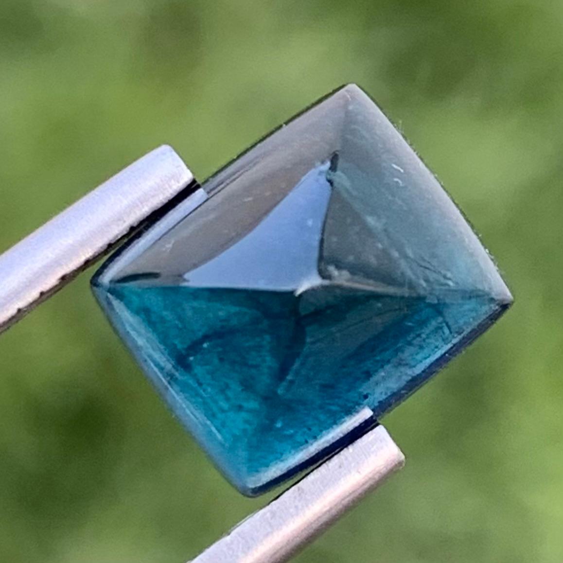 Indicolite Tourmaline Sugarloaf Cabochon 
Weight: 5.65 Carats 
Dimension: 9.4 x 8.4 x 8.3 Mm 
Colour: Blue 
Origin: Afghanistan 
Treatment: Non 
Certificate: On Demand 

Indicolite tourmaline, prized for its stunning blue hues ranging from serene