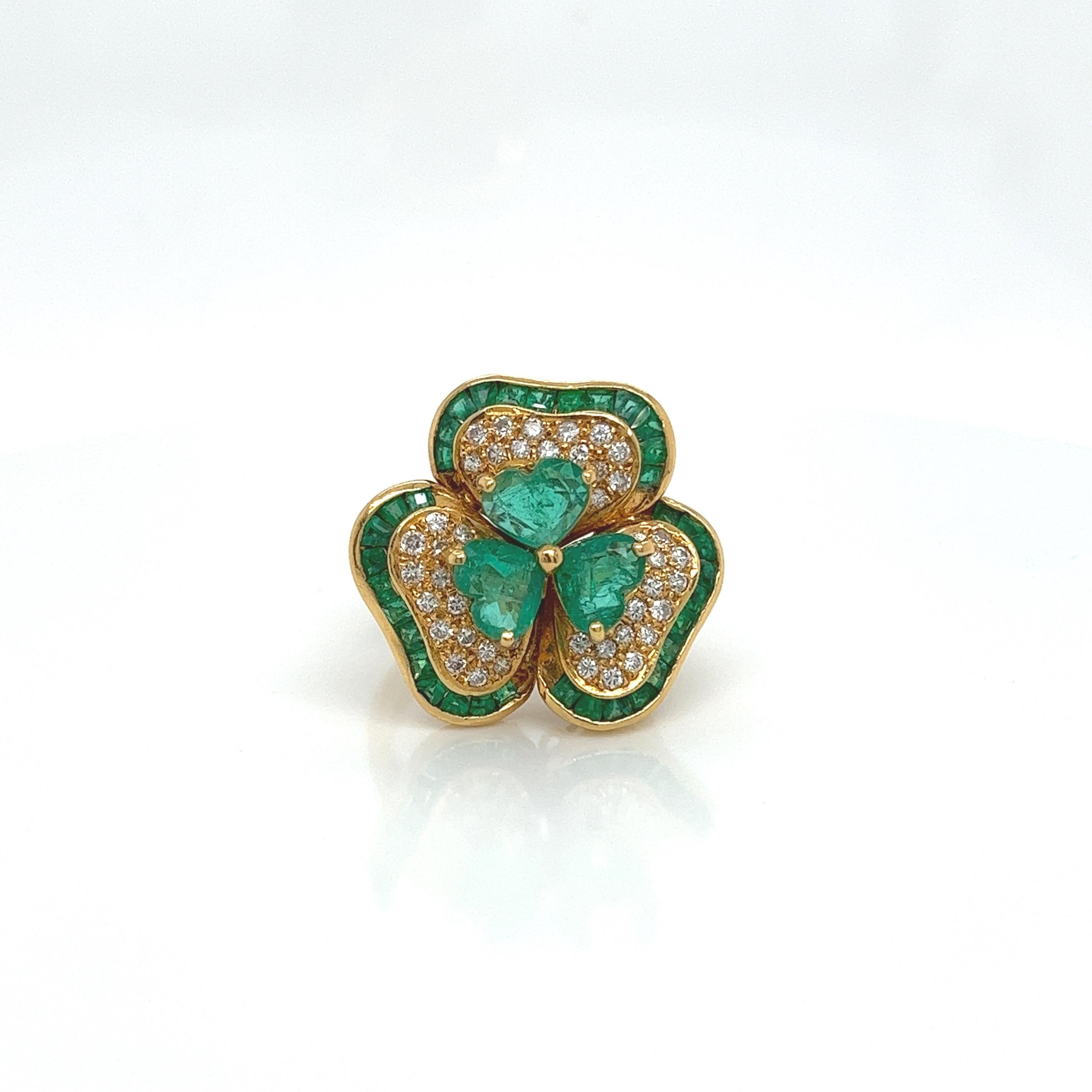 5.65 Total Carat Lucky Clover 18K Yellow Gold Diamond & Colombian Green Emerald Ladies Ring

SPECIFICATIONS:
-Main Emeralds: 3.60ct Colombian Green Emeralds
-Side Emeralds: 1.50ct Chanel Set Emeralds
-Diamonds: 0.55ct Round Brilliant Cut